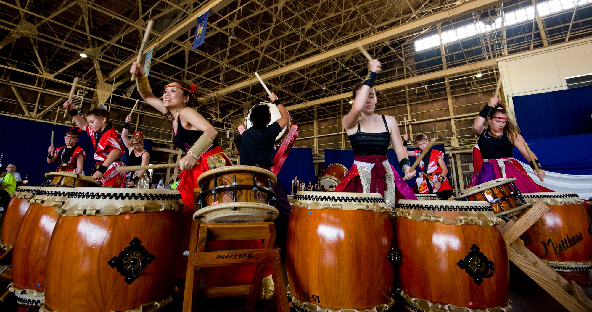 The Dragon-Eagle Taiko team performs "A-un" for athletes and volunteers in Hangar 949 during the annual Special Olympics at Misawa Air Base, Japan, Aug. 28, 2010. Other performers were the varsity cheerleading team and Misawa Islanders Dance and Entertainment Group. (U.S. Air Force photo by Staff Sgt. Samuel Morse/Released)