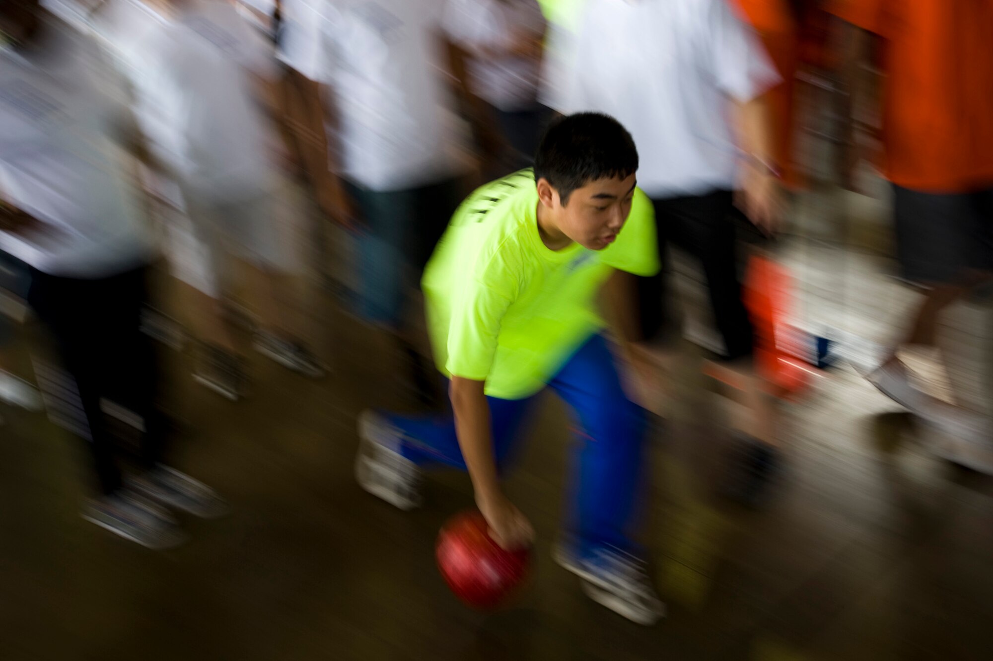 A Special Olympics athlete bowls in Hangar 949 during the annual Special Olympics at Misawa Air Base, Japan, Aug. 28, 2010. Athletes were each paired with two volunteers to help them with the events and cheer them on. (U.S. Air Force photo by Staff Sgt. Samuel Morse/Released)