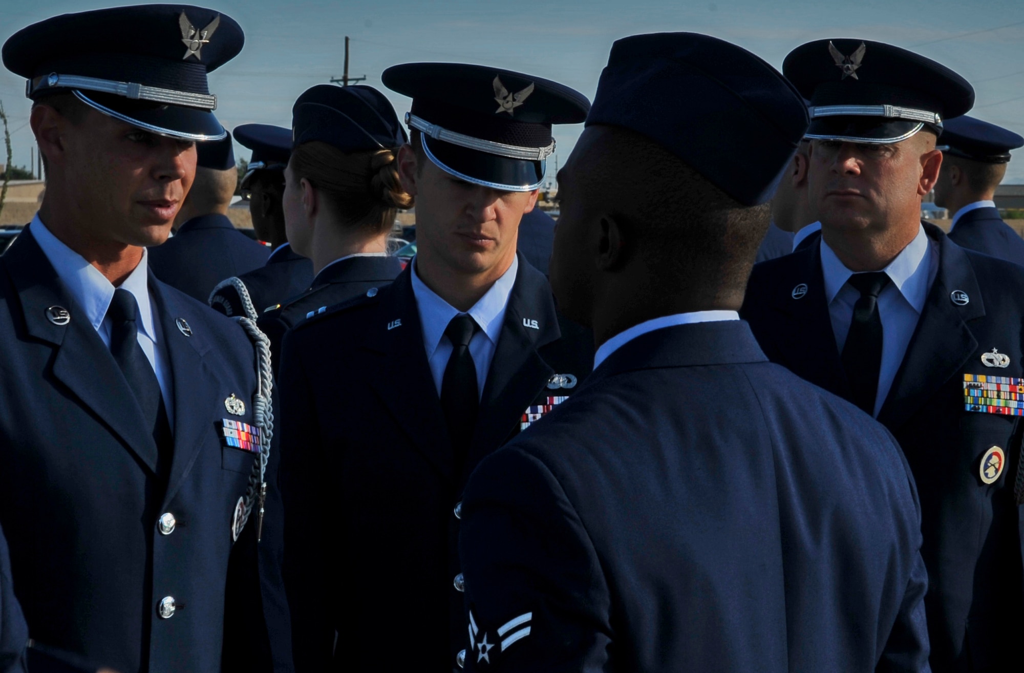 HOLLOMAN AIR FORCE BASE, N.M. -- Staff Sgt. Mitchell Bisson, Capt. Ronald Miller and Tech Sgt. Troy Bizzack, all leaders of the Holloman Steel Talon Honor Guard, inspect Airman 1st Class Samuel Herring, 49th Material Maintenance Group, during an open ranks inspection at Heritage Park Aug. 17, 2010. The base honor guard performs open ranks once a month to exercise discipline and to ensure their uniforms are serviceable.  (U.S. Air Force photo by Airman 1st Class Joshua Turner / Released)
