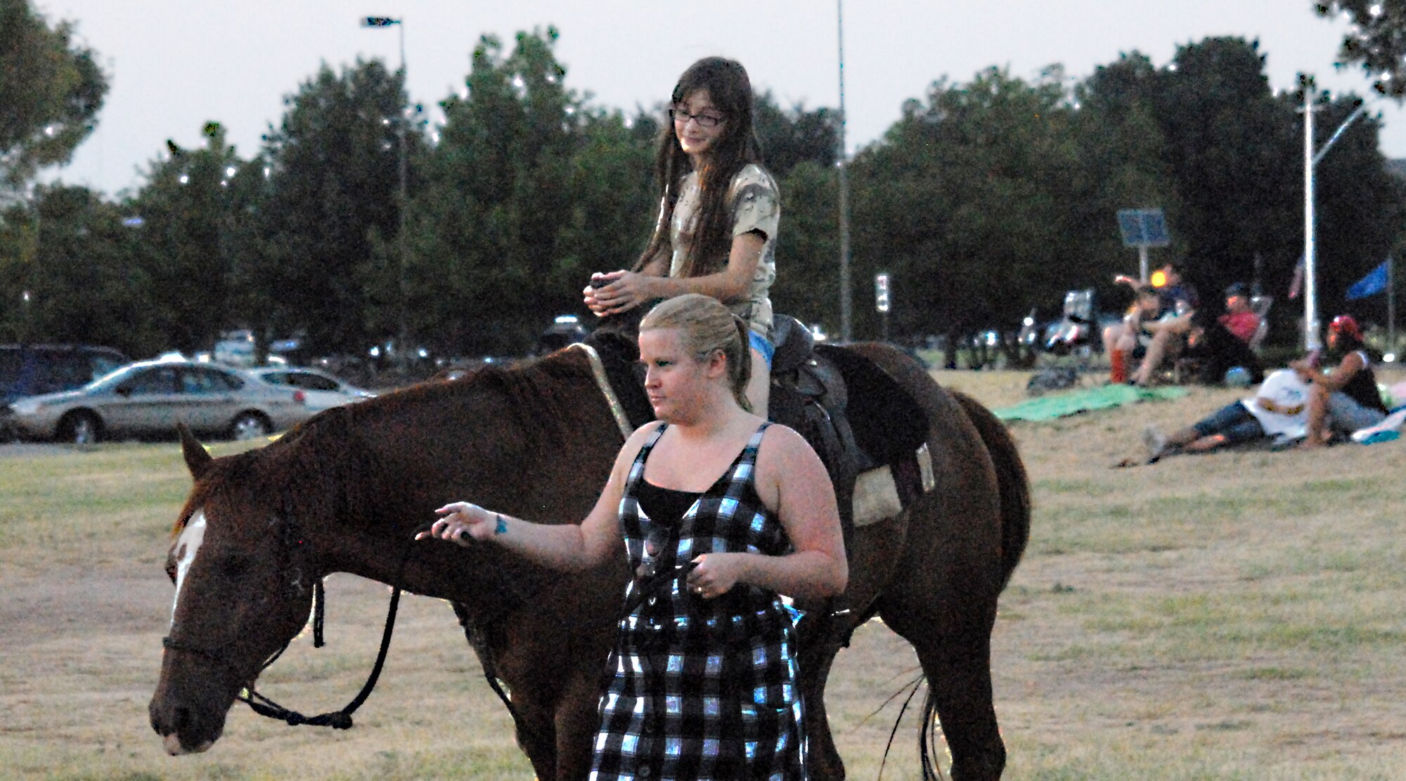 Shanna King, 10, gets her turn to ride the horse during the Year of the Air Force Family finale celebration Aug. 27. More than 100 families gathered on the field by the Event Center for free food, games and a movie on the lawn.(U.S. Air Force photo/Connie Hempel)