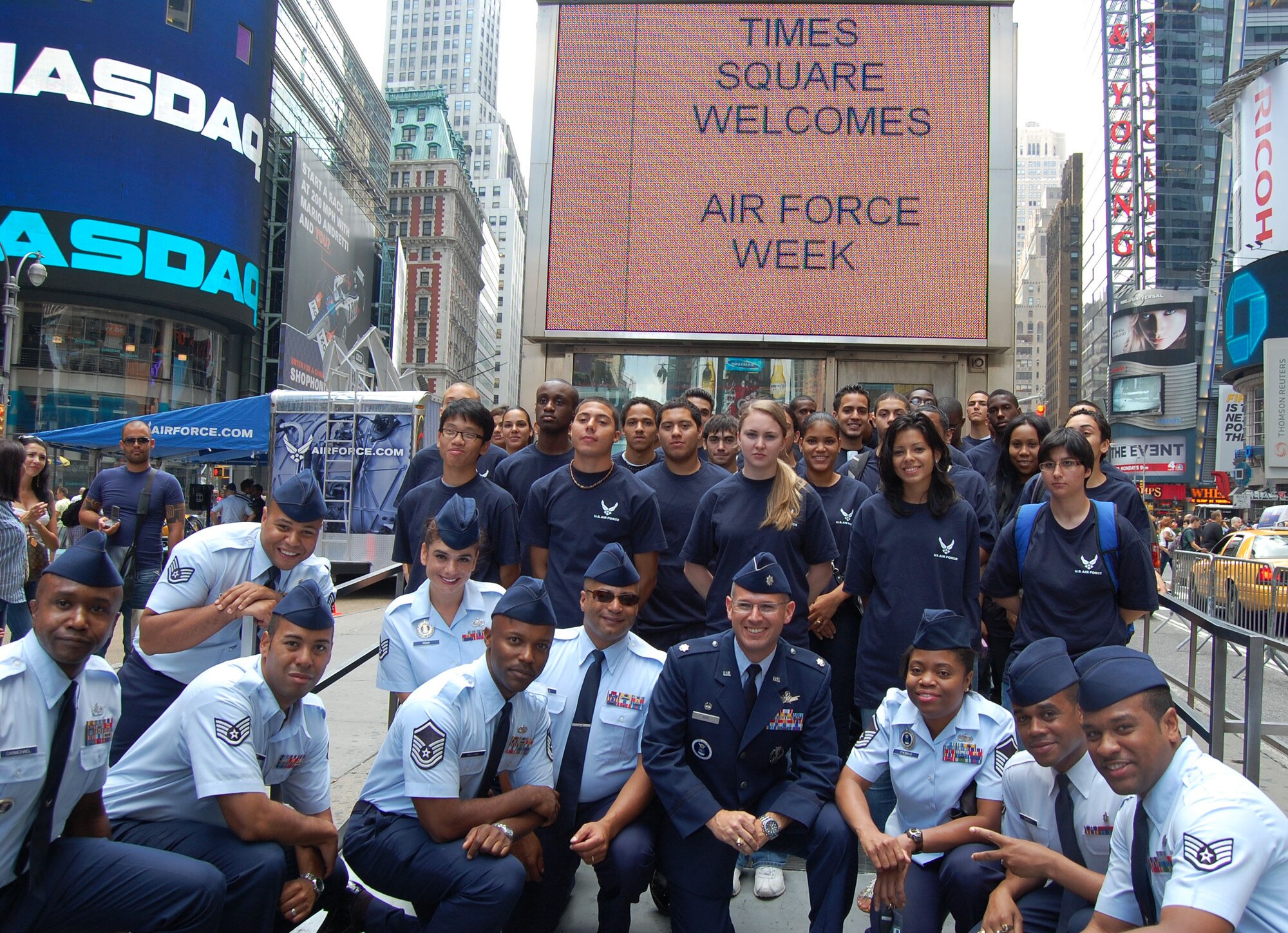 Airmen from the 313th Recruiting Squadron pose with members of the Delayed Enlistment Program in Times Square Aug. 26, 2010, during Air Force Week in New York City. Air Force Recruiting assets on hand included the Engage Tour, Command Center Alpha, two Air Force Monster Trucks and the Orange County Chopper. “We're proud to showcase America's Air Force here in Times Square,” said Lt. Col. Robert D. Roy, 313th RCS commander. (U.S. Air Force photo/Master Sgt. Steve Acevedo)