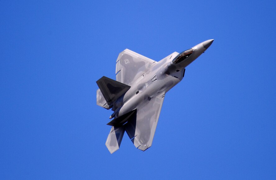 OFFUTT AIR FORCE BASE, Neb. - An F-22 Raptor glides across the sky as part of the 2010 Defenders of Freedom Open House and Air Show, Aug. 28.  This was the Raptors first appearance at Offutt's annual Air Show which included this and other aerial demonstrations, as well as ground shows and static aircraft displays. U.S. Air Force photo by Josh Plueger
