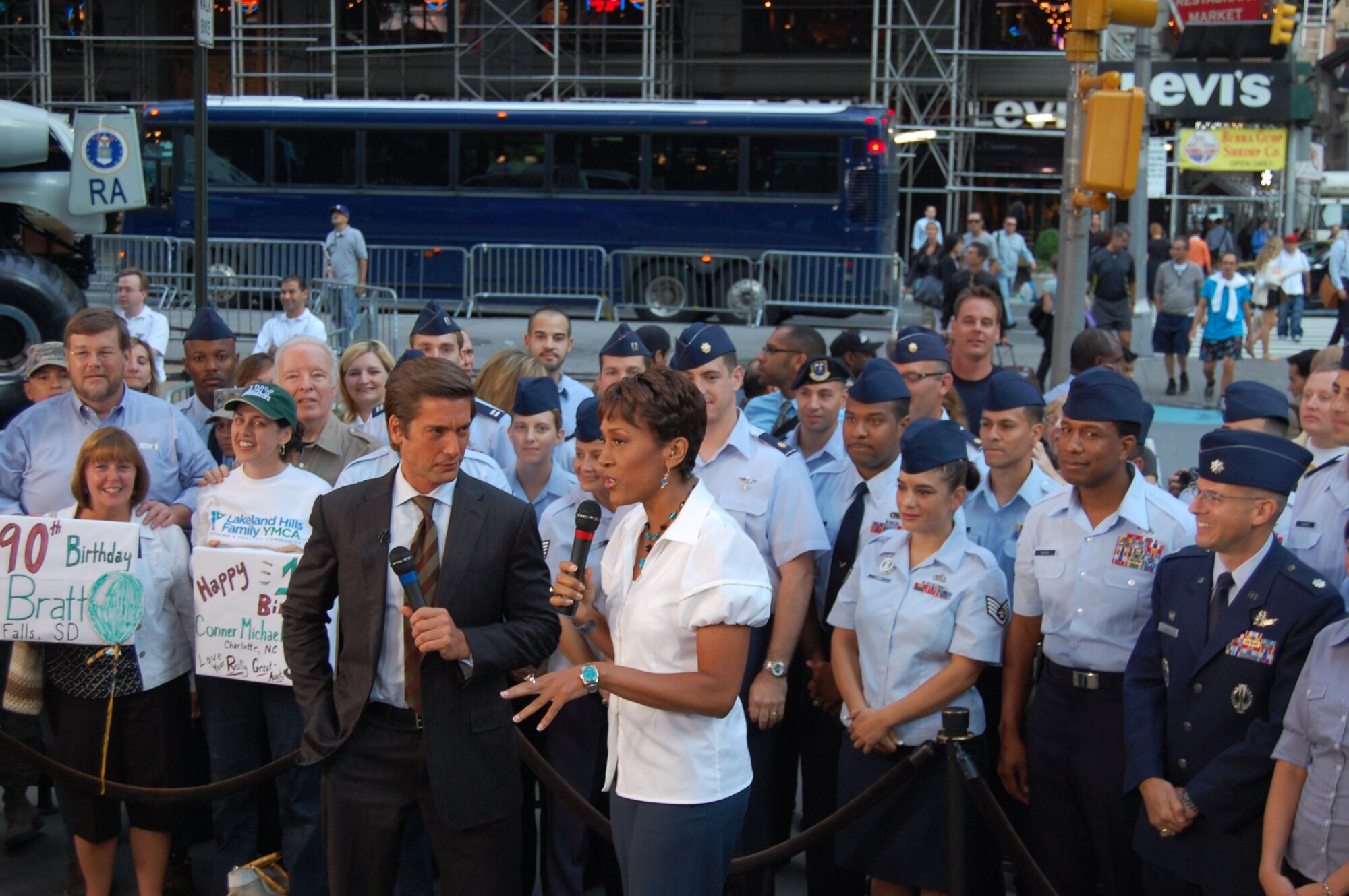 David Muir and Robin Roberts of “Good Morning America” stand outside the show’s studio Aug. 26, 2010, with members of the 313th Recruiting Squadron during Air Force Week in New York City. After an appearance on the show, squadron members went to Times Square where they conducted a Delayed Enlistment Program swear-in and a promotion ceremony. Air Force Recruiting assets on hand included the Engage Tour, Command Center Alpha, two Air Force Monster Trucks and the Orange County Chopper. The Air Force Drill Team from Bolling AFB, Washington, D.C., also displayed their sophisticated skills of precision rifle-spinning and the rock band Afterburner from Hanscom AFB, Mass., moved the crowd with their performances. “We're proud to showcase America's Air Force here in Times Square,” said Lt. Col. Robert D. Roy, 313th RCS commander. (U.S. Air Force photo/Master Sgt. Steve Acevedo)