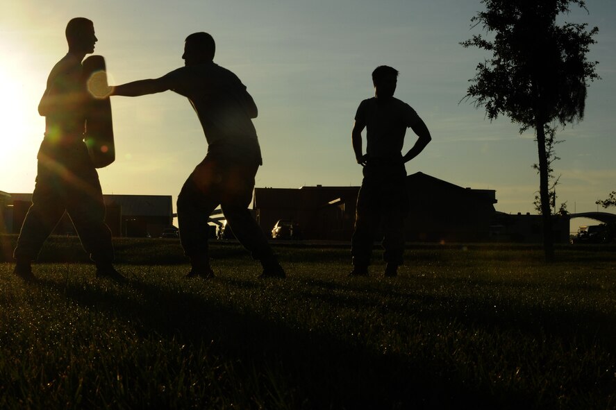 MOODY AIR FORCE BASE, Ga. -- Members of the 822nd Security Forces Squadron came out early to practice their skills in Krav Maga here Aug. 20. Krav Maga is a simple, effective self defense system that emphasizes instinctive movements, practical techniques, and realistic training scenarios. (U.S. Air Force photo/ Airman 1st Class Benjamin Wiseman)
