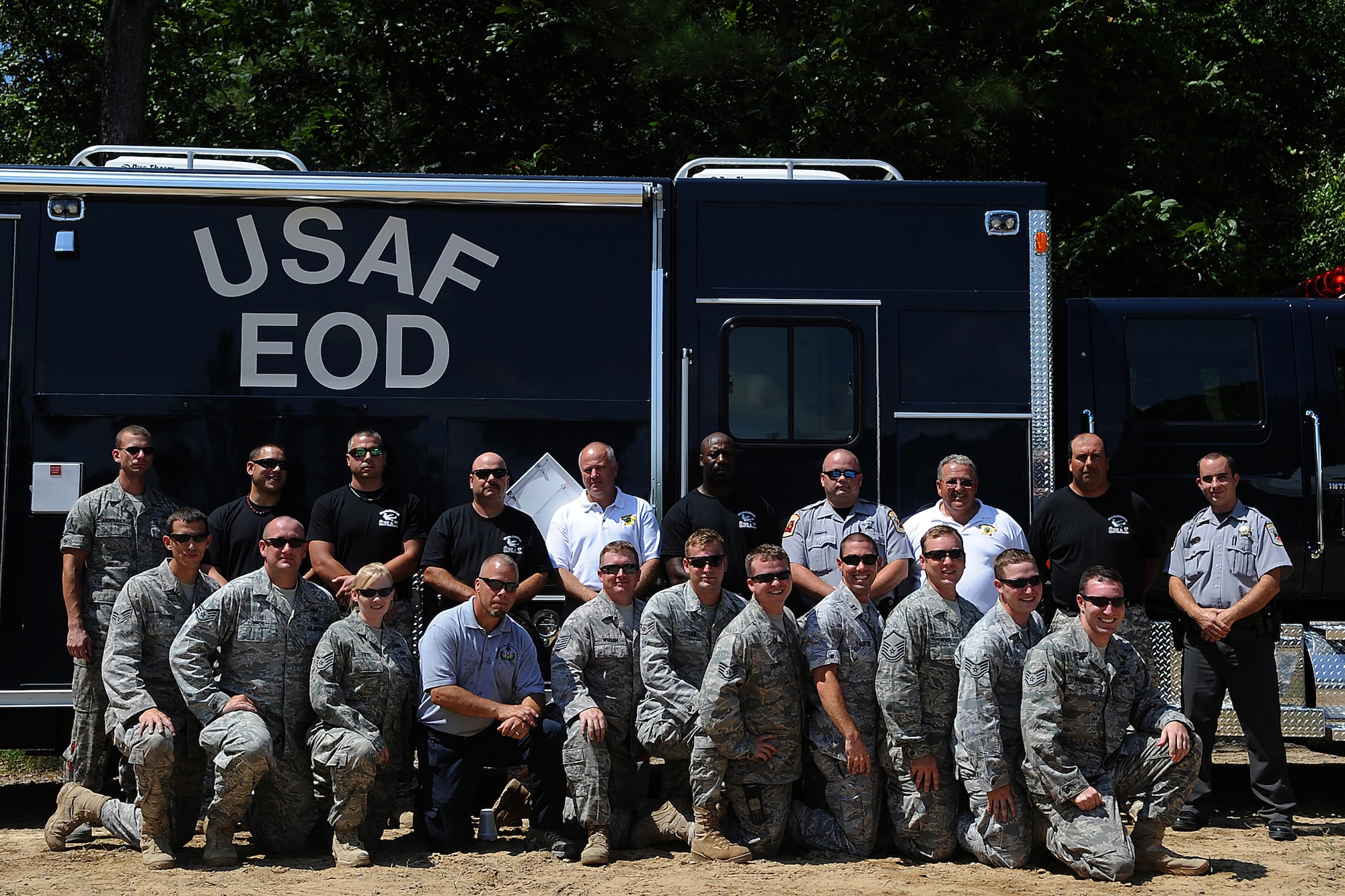 SEYMOUR JOHNSON AIR FORCE BASE, N.C. – Airmen from the 4th Civil Engineering Squadron Explosive Ordnance Disposal team and members of Wayne County Sheriff’s Office pose for a photo after participating in a joint training exercise Aug. 25, 2010. As part of the training, EOD Airmen displayed techniques such as how to breech a door and various ways to disarm bombs and suspicious packages. (U.S. Air Force photo/Senior Airman Makenzie Lang)
