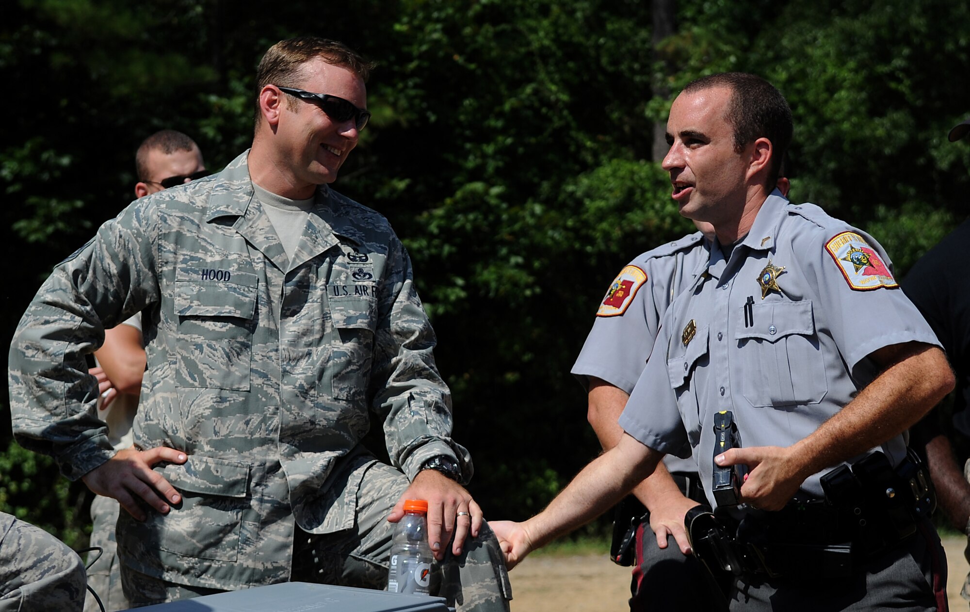 SEYMOUR JOHNSON AIR FORCE BASE, N.C. – Members of Wayne County Sheriff’s Office and the 4th Civil Engineering Squadron’s Explosive Ordnance Disposal team investigate the aftermath of a multi layered vehicle disrupter explosion during a joint training exercise Aug. 25, 2010. Military and civilian law enforcement partnerships enhance familiarization of their capabilities allowing for smoother operations in the event they must work together. (U.S. Air Force photo/Senior Airman Makenzie Lang)

