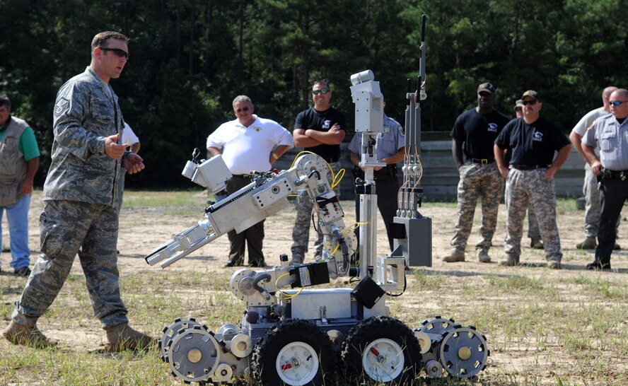 SEYMOUR JOHNSON AIR FORCE BASE, N.C. – Master Sgt. Van Hood explains uses of an F6 Android to members of the Wayne County Sheriff’s Office during a joint training exercise Aug. 25, 2010. Explosive Ordnance Disposal teams use this robot for reconnaissance, placing charges and keeping distance between personnel and explosives. Sergeant Hood, 4th Civil Engineering Squadron explosive ordnance disposal superintendent, is from Greensboro. (U.S. Air Force photo/Senior Airman Makenzie Lang)
