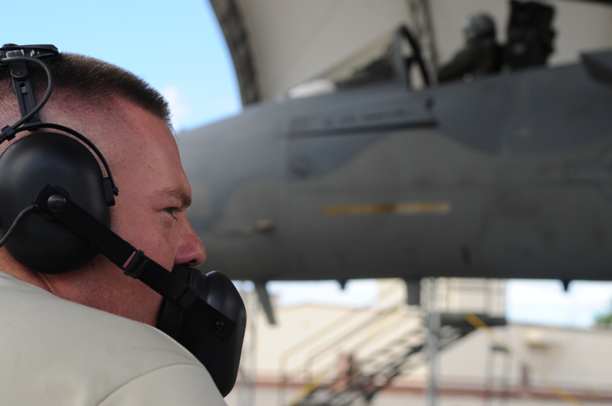 JOINT BASE PEARL HARBOR-HICKAM, Hawaii - F-15 Eagle crew chief, Airman First Class David Lairsey (left) communicates with pilot, Lt. Col Mark "Odie" Ladtkow of the 199th Fighter Squadron, Hawaii Air National Guard, Joint Base Pearl Harbor-Hickam, as he prepares for his last F-15 training mission on Aug. 25 at Hickam. The 199th is transitioning from the F-15 to the F-22 Raptor, which is a fifth generation fighter. The 199th has flown the F-15 since 1987 and received their first two Raptors on July 9, 2010.  (U.S.  Air Force photo/Tech Sgt. Cohen A. Young)