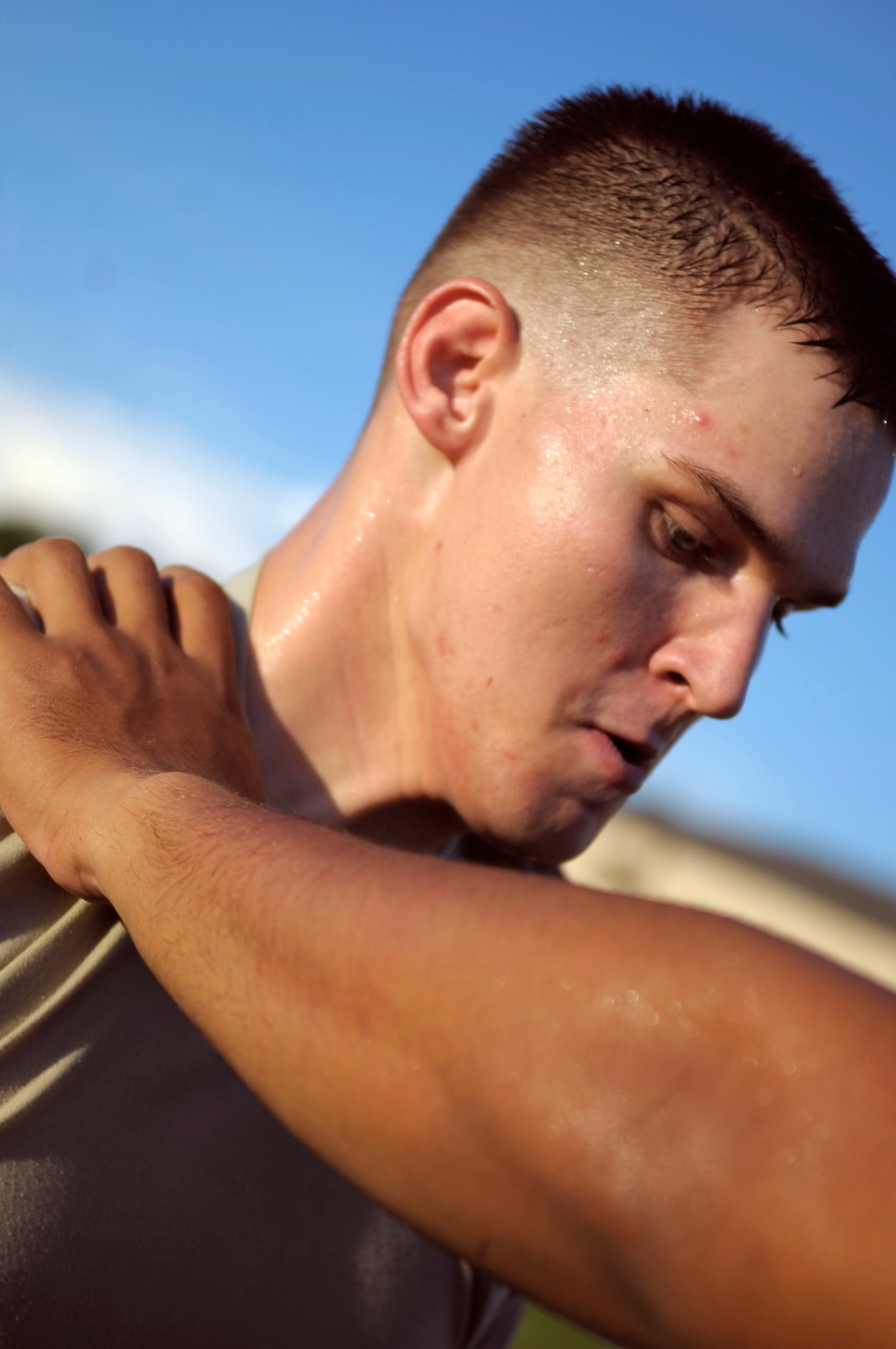 Airman 1st Class James Leach, 822 Security Forces Squadron fire team member, is being chocked during Krav Maga training here Aug. 20. Krav Maga is the official self defense system of the Israeli Defense Forces. During this training session, 822nd SFS members were being trained on choke defense and weapons take away. (U.S. Air Force photo/Staff Sgt. Andrea Thacker)
