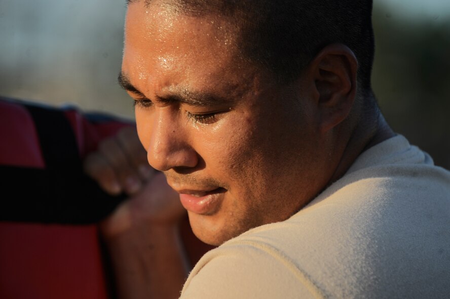 Senior Airman Billy Palomo, 822nd Security Forces Squadron fire team leader, holds a pad during Krav Maga training here Aug. 20. Krav Maga is the official self defense system of the Israeli Defense Forces. Each member of the 820th Security Forces Group is trained in Krav Maga for self defense against an armed enemy. (U.S. Air Force photo/Staff Sgt. Andrea Thacker)