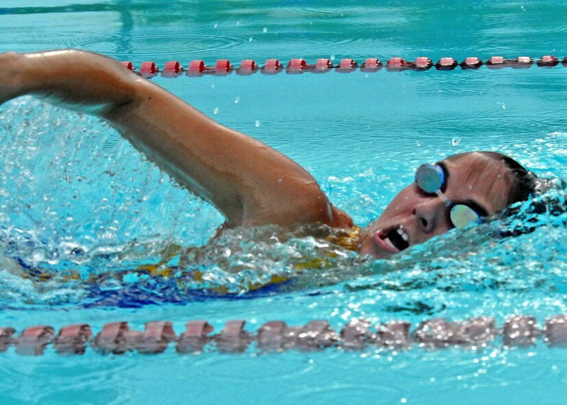 Sara Gauthier, 96th Air Base Wing, comes up for air while swimming her leg of the freestyle relay during the first-ever Water Olympics at Eglin Air Force Base, Fla., Aug. 27.  Teams from three different wings competed in three separate team-swimming relays.  The 53rd team dominated the event winning all three relays with ease.  A team from 46th Test Wing also competed.  (U.S. Air Force photo/Samuel King Jr.)