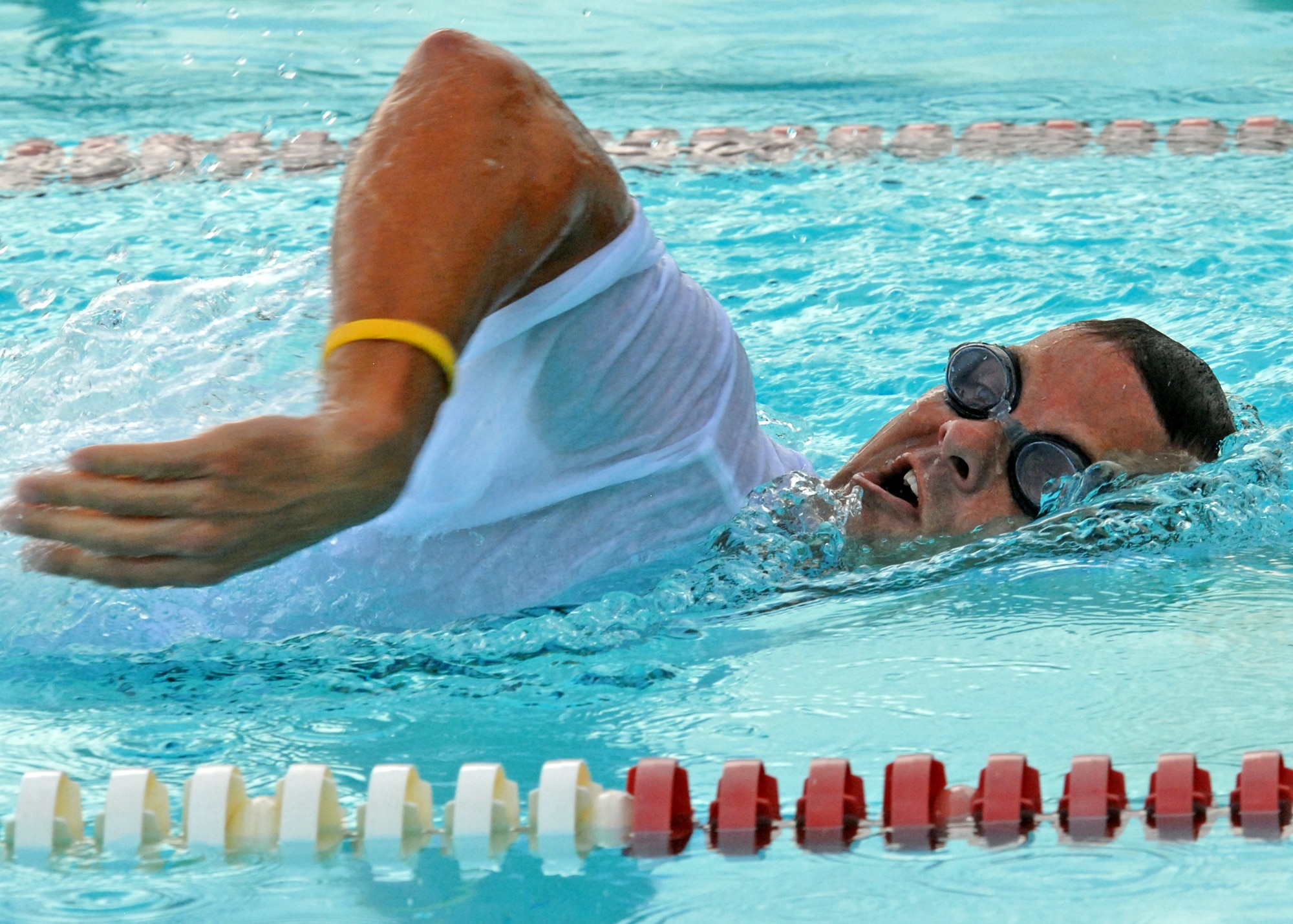 Joe Lafitte, 53rd Wing, comes up for air while swimming his leg of the freestyle relay during the first-ever Water Olympics at Eglin Air Force Base, Fla., Aug. 27.  Teams from three different wings competed in three separate team-swim relays.  The 53rd team dominated the event winning all three relays with ease.   Teams from the 46th Test Wing and 96th Air Base Wing also competed.   (U.S. Air Force photo/Samuel King Jr.)