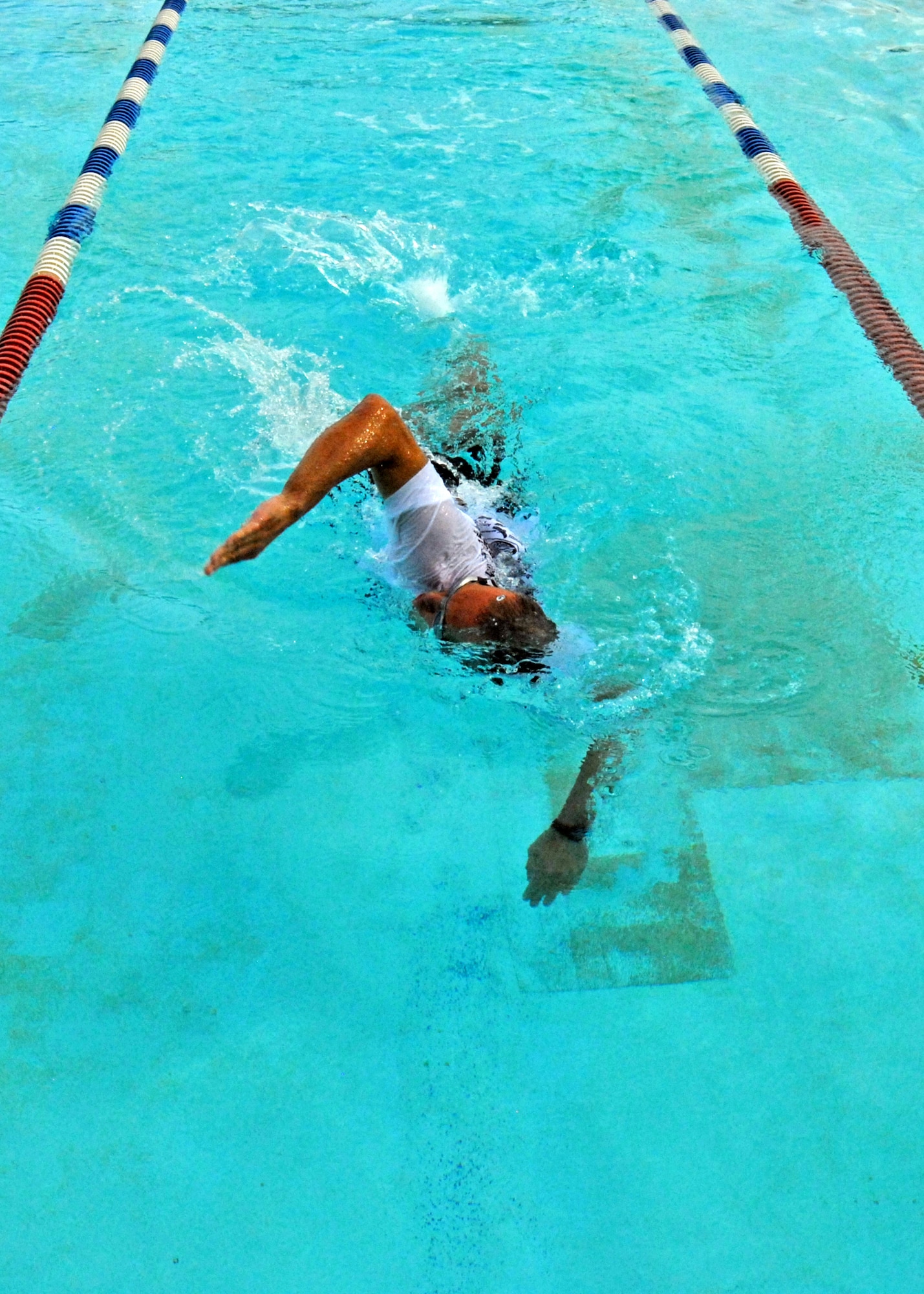Greg Kopeck, 53rd Wing, swims his leg of the freestyle relay during the first-ever Water Olympics at Eglin Air Force Base, Fla., Aug. 27.  Teams from three different wings competed in three separate team-swimming relays.  The 53rd team dominated the event winning all three relays with ease.  Teams from the 46th Test Wing and 96th Air Base Wing also competed.  (U.S. Air Force photo/Samuel King Jr.)