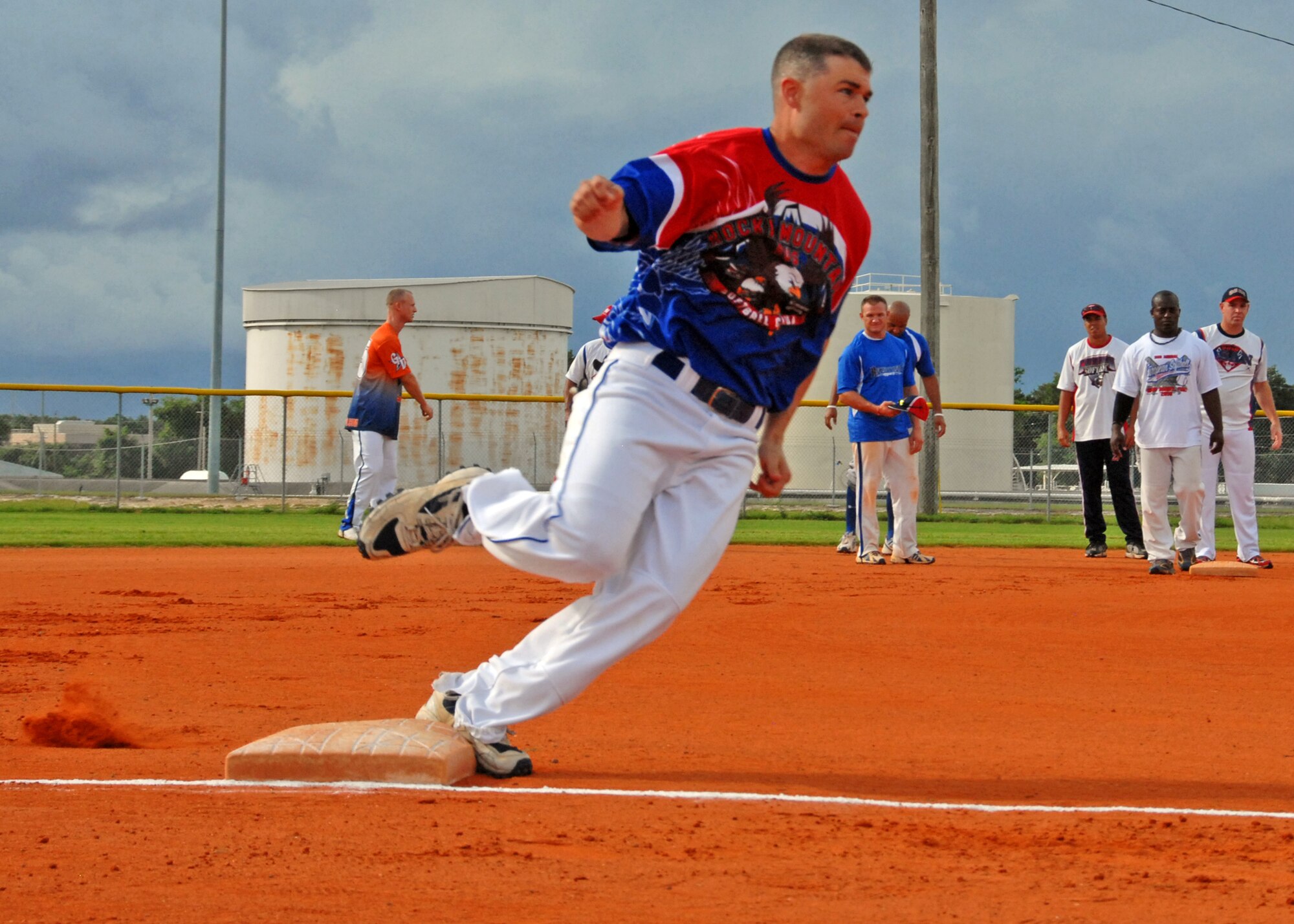 A player rounds third base sprinting for home during a practice session Aug. 27.  The Air Force Softball team began tryouts and practice last week at Eglin Air Force Base, Fla.  Each player was timed on their sprint from second base to home plate during the practice.  The head coach will sort through 26 players to fill the 14-man roster prior to competing in the Armed Forces Championship, Sept. 18-24.  The Air Force team won the championship last year.  (U.S. Air Force photo/Samuel King Jr.)