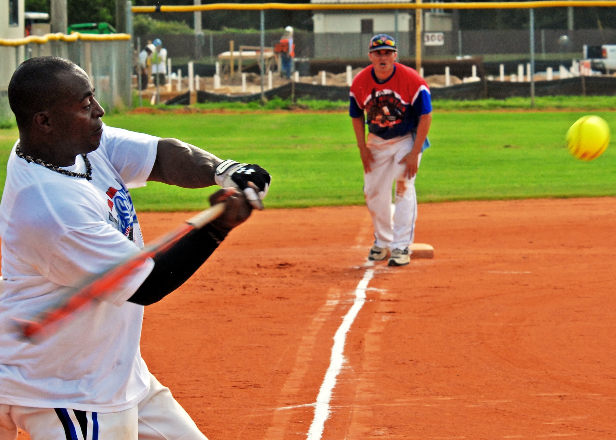 A batter tries to bring home his teammate at third with a base hit during a practice game Aug. 27.  The Air Force Softball team began tryouts and practice last week at Eglin Air Force Base, Fla.  The head coach will sort through 26 players to fill the 14-man roster prior to competing in the Armed Forces Championship, Sept. 18-24.  The Air Force team won the championship last year.  (U.S. Air Force photo/Samuel King Jr.)