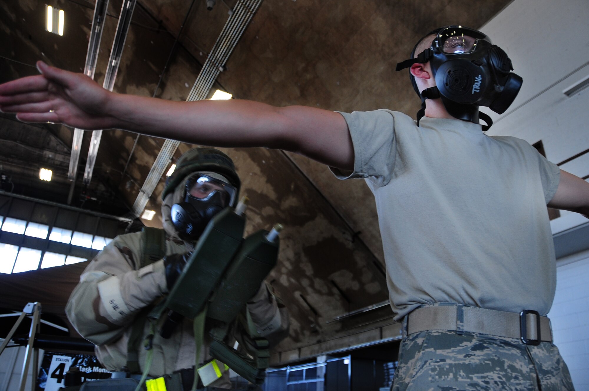 ELLSWORTH AIR FORCE BASE, S.D. -- (Left to right) Senior Airman Hugh
Blacketor, 28th Civil Engineer Squadron heating, ventilation and
air-conditioning journeyman, uses two hand-held chemical detectors to check for simulated contamination on Airman 1st Class  Michael Mays, 28 CES structural apprentice, during a phase II operational readiness exercise, Aug. 24.  During the exercise, Airmen are tested on their knowledge and abilities while under simulated chemical attacks. (U.S. Air Force photo/Airman 1st Class Anthony Sanchelli)
