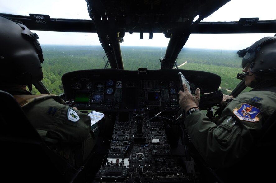 MOODY AIR FORCE BASE, Ga. -- Two pilots from the 41st Rescue Squadron fly an HH-60G Pave Hawk out to the Grand Bay Bombing and Gunnery Range to begin munitions training here Aug. 25. Each pilot took turns flying tactical maneuvers during the training. (U.S. Air Force photo/Airman 1st Class Benjamin Wiseman)
