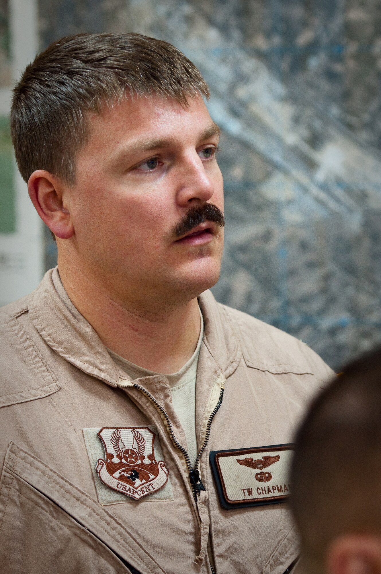 SOUTHWEST ASIA - Capt. T.W. Chapman, a pilot with the 737th Expeditionary Airlift Squadron, conducts a pre-flight briefing at an undisclosed airbase here Aug. 30, 2010, as Airmen from the 386th Air Expeditionary Wing prepare to fly relief supplies into Pakistan. Record-setting monsoons have killed more than 1,600 Pakistanis and left over 2 million homeless, government officials said. The Airmen will be based at Bagram Air Field, Afghanistan, for the relief mission, which has already delievered hundereds of thousands of pounds of food, water and medicine to Pakistan. (U.S. Air Force photo by Maj. Dale Greer/Released)