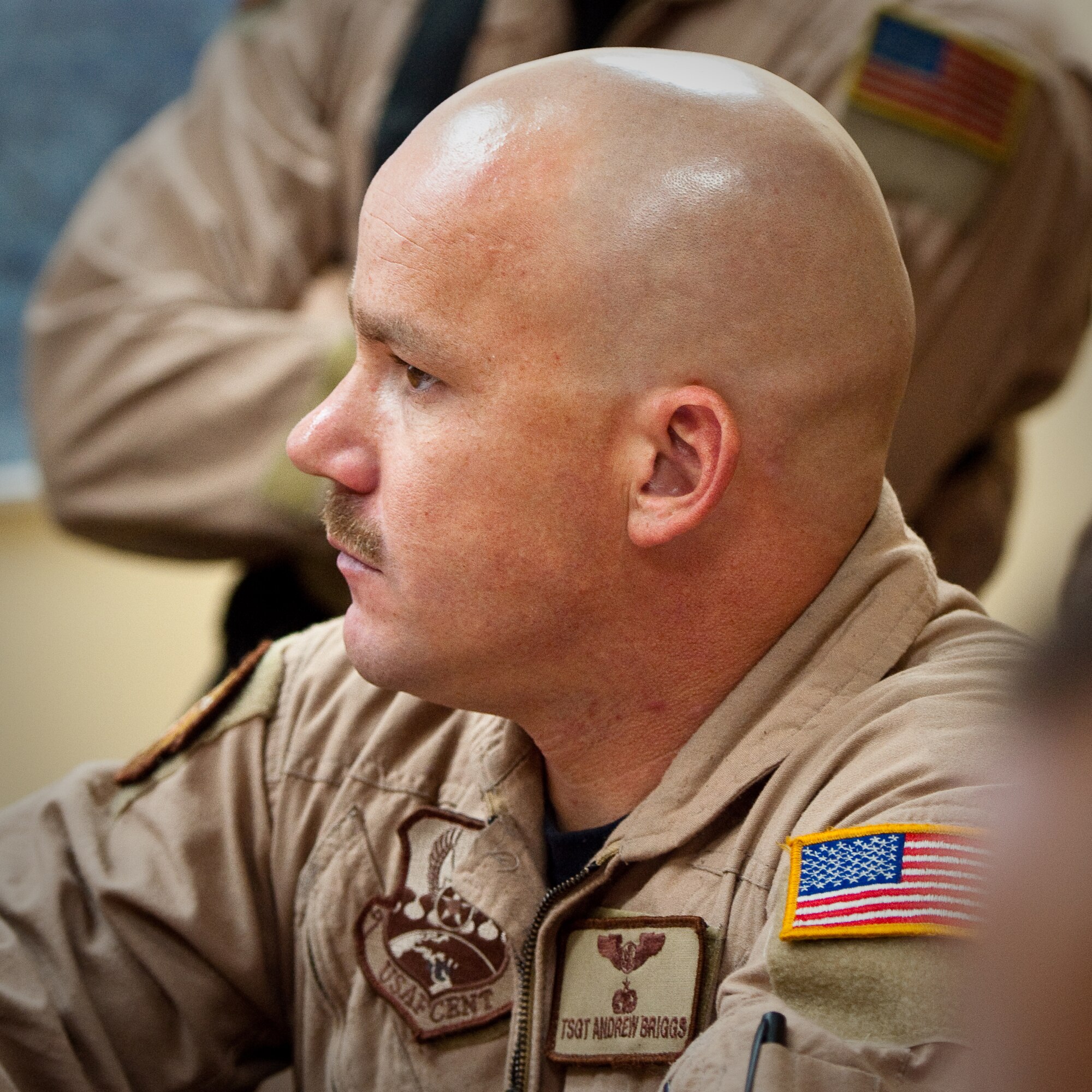 SOUTHWEST ASIA - Tech. Sgt. Andrew Briggs, a loadmaster with the 737th Expeditionary Airlift Squadron, listens to a pre-flight intelligence briefing at an undisclosed airbase here Aug. 30, 2010, as Airmen from the 386th Air Expeditionary Wing prepare to fly relief supplies into Pakistan. Record-setting monsoons have killed more than 1,600 Pakistanis and left over 2 million homeless, government officials said. The Airmen will be based at Bagram Air Field, Afghanistan, for the relief mission, which has already delievered hundereds of thousands of pounds of food, water and medicine to Pakistan. (U.S. Air Force photo by Maj. Dale Greer/Released)