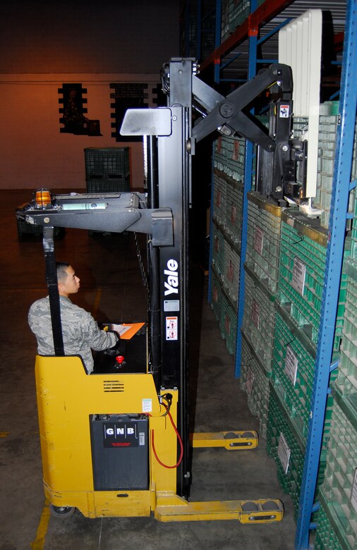 Airman 1st Class Jung Lim, 43rd Logistics Readiness Squadron Material Management Technician, uses a fork lift to place a crate of supplies on the shelf in the warehouse Aug. 25. (U.S. Air Force photo/Senior Airman Kris Levasseur)