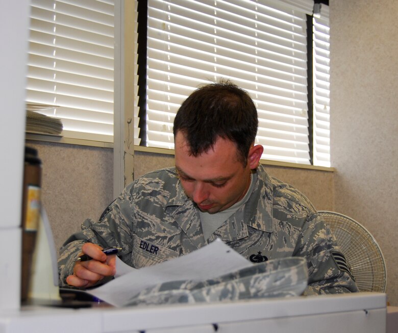 Staff Sgt. Brad Edler, 43rd Logistics Readiness Squadron Material Management Technician, reviews several parts orders at the material management flight’s aircraft parts store on Aug. 25. (U.S. Air Force photo/Senior Airman Kris Levasseur)