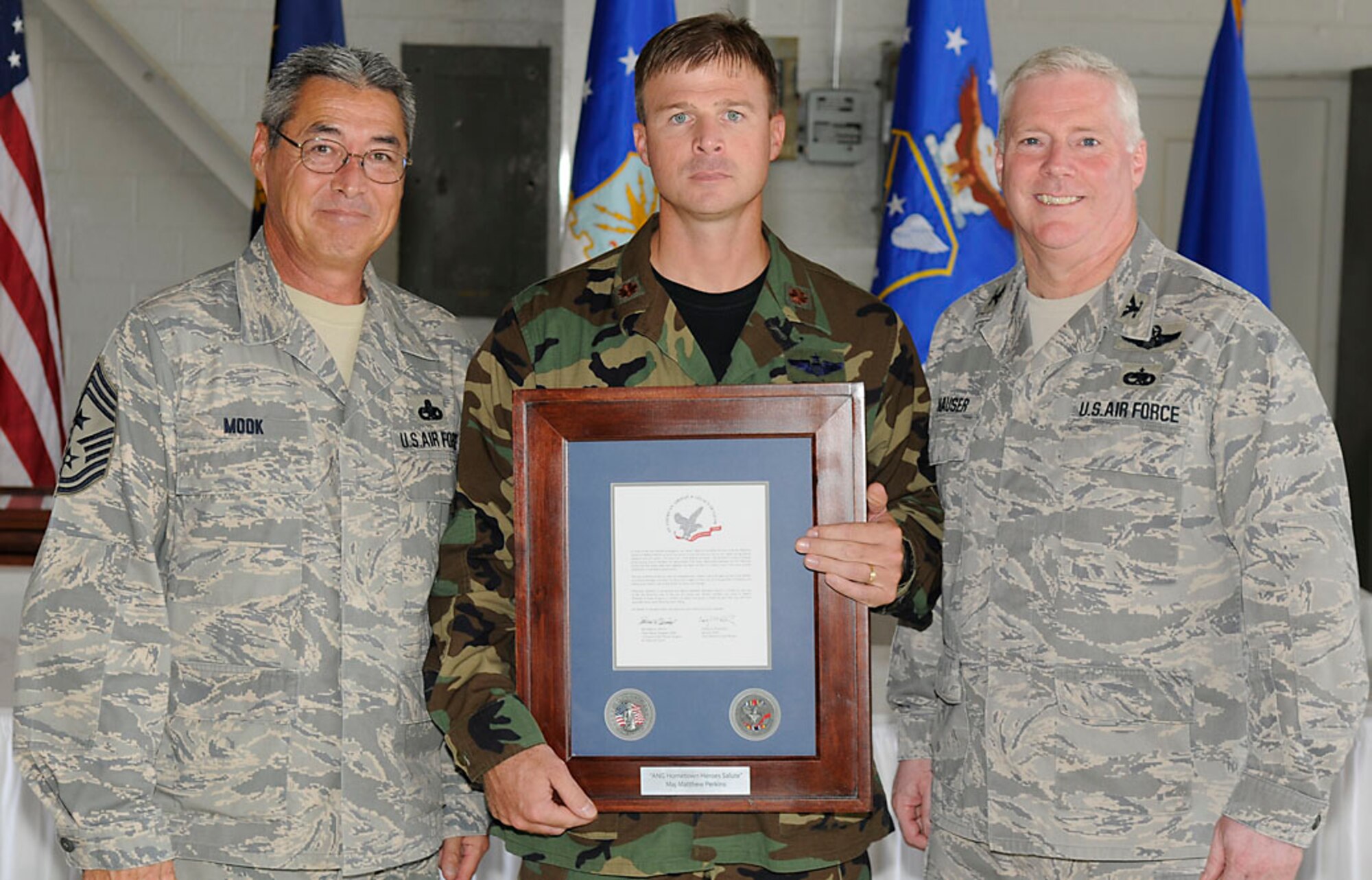 Chief Master Sgt. Henry Mook, Maj. Matthew Perkins and Col. Jeff Hauser.  Photo by Master Sgt. John Day