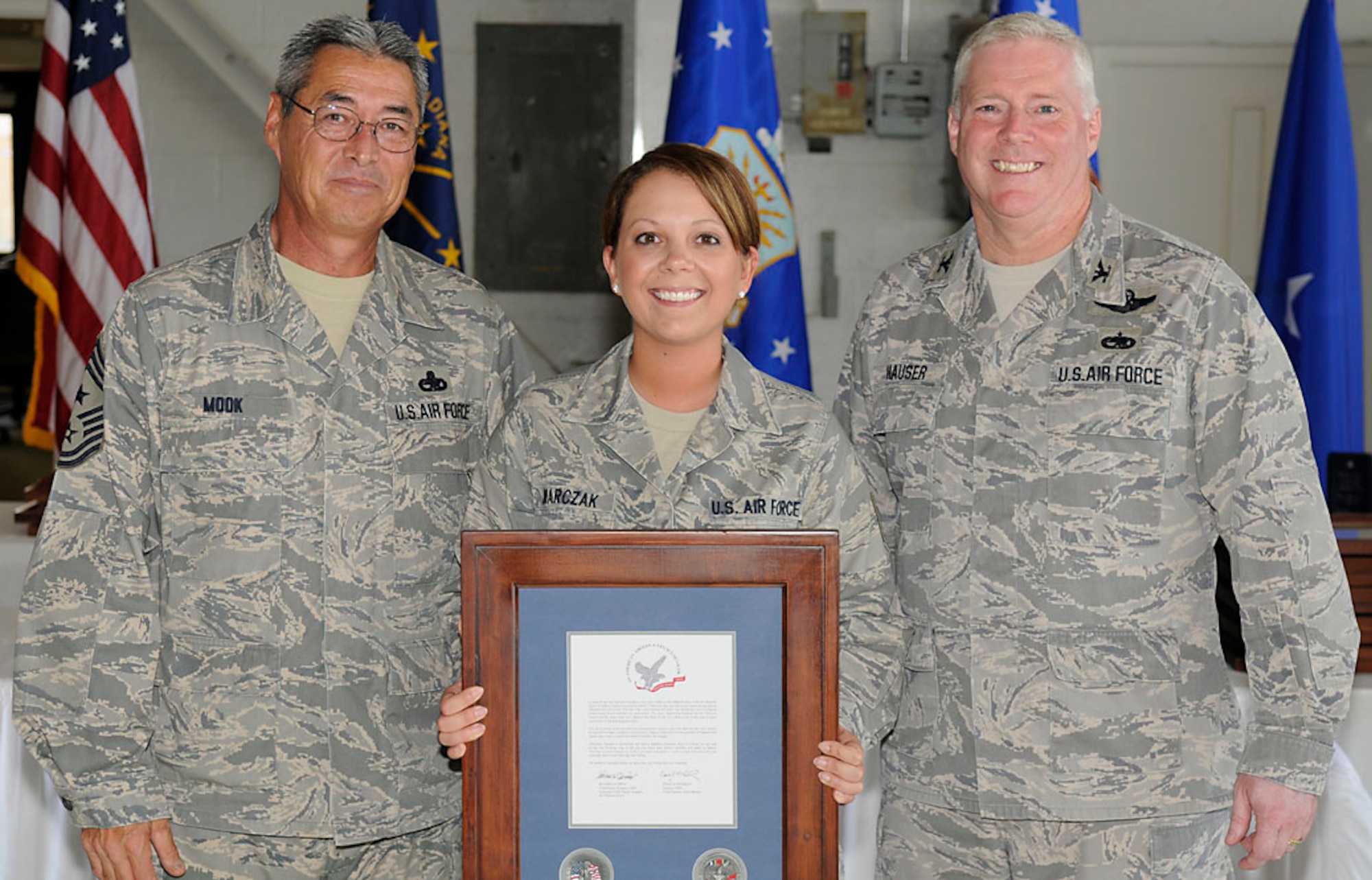 Chief Master Sgt. Henry Mook, Tech. Sgt. Amberlee Marczak and Col. Jeff Hauser.  Photo by Master Sgt. John Day