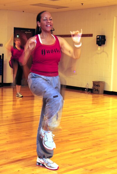 ELLSWORTH AIR FORCE BASE, S.D. -- Keke Pringle teaches a dance exercise class, Aug. 20.  "We go from salsa, to hip-hop, to step aerobic moves, to funk, into some Latin-inspired moves and beyond," said Mrs. Pringle. (U.S. Air Force photo/Airman 1st Class Anthony Sanchelli)