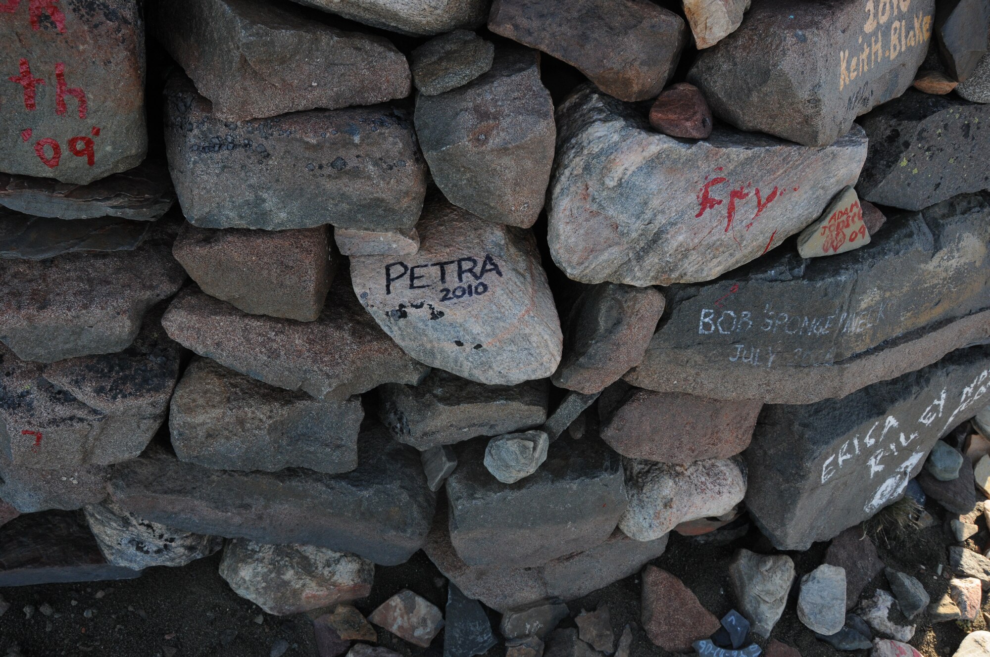 Thirty-three Airmen from the 821st Support Squadron at Thule Air Base, Greenland, hiked up the 724-foot high Thule landmark, Mount Dundas, Aug. 23. In keeping with tradition, Airmen wrote their names on rocks they carried from the bottom and placed them in a pile that marks all of those who have braved the Mount Dundas climb. (U.S. Air Force photo/Master Sgt. Petra Wright)