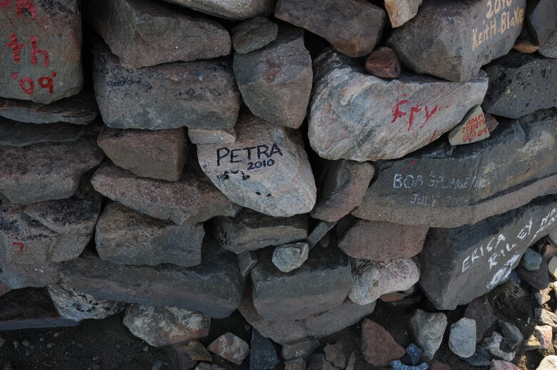Thirty-three Airmen from the 821st Support Squadron at Thule Air Base, Greenland, hiked up the 724-foot high Thule landmark, Mount Dundas, Aug. 23. In keeping with tradition, Airmen wrote their names on rocks they carried from the bottom and placed them in a pile that marks all of those who have braved the Mount Dundas climb. (U.S. Air Force photo/Master Sgt. Petra Wright)
