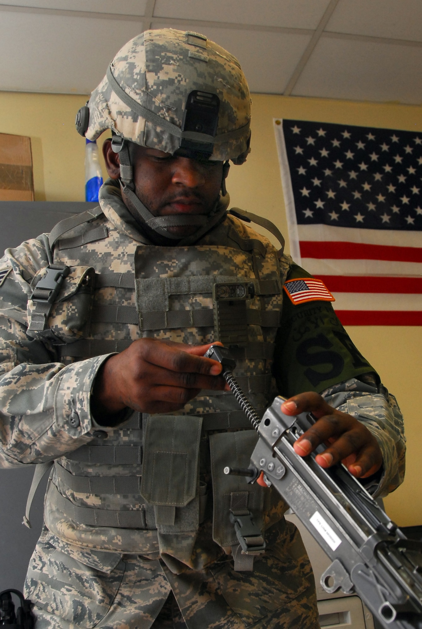 Senior Airman Wayne Richard, 332nd Expeditionary Security Forces Squadron installation patrolman, reassembles an M-249 squad assault rifle for the weapons knowledge portion of the monthly Safe Side Challenge competition Aug. 14, 2010, Joint Base Balad, Iraq. The importance of weapons knowledge is critical when dealing with stoppages and malfunctions. Airman Richard is a native of New Orleans, La., deployed from Lackland Air Force Base, Texas. (U.S. Air Force photo/Senior Airman Marianne E. Lane)