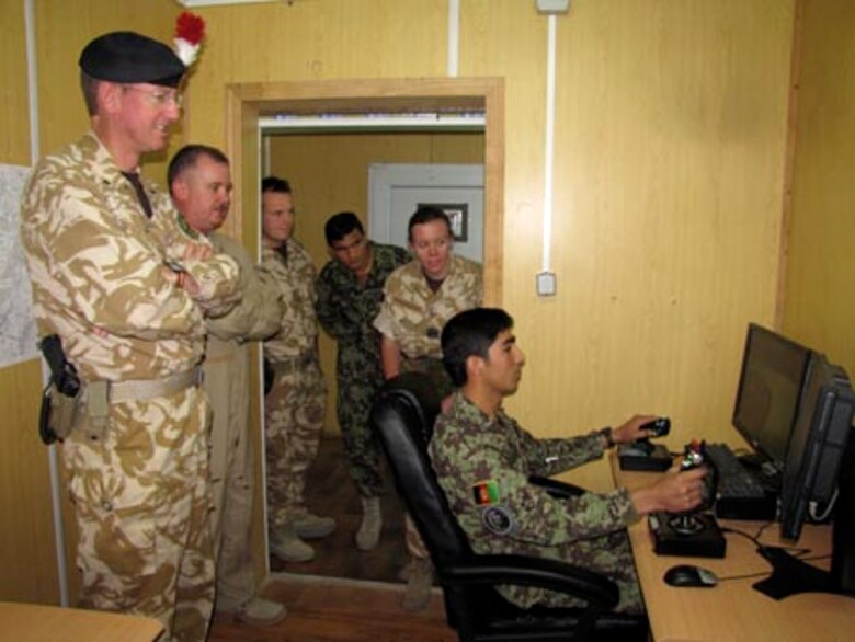 Brigadier David Paterson Commander Combined Training Advisory Group-Army tours the Afghan Air Force Thunder Lab in Kabul on August 28, 2010 (U.S. Navy photo by Mass Communications Specialist First Class Elizabeth Burke/RELEASED).