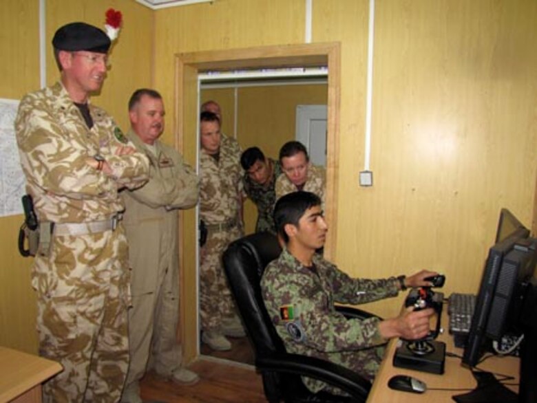 Brigadier David Paterson Commander Combined Training Advisory Group-Army tours the Afghan Air Force Thunder Lab in Kabul on August 28, 2010 (U.S. Navy photo by Mass Communications Specialist First Class Elizabeth Burke/RELEASED).