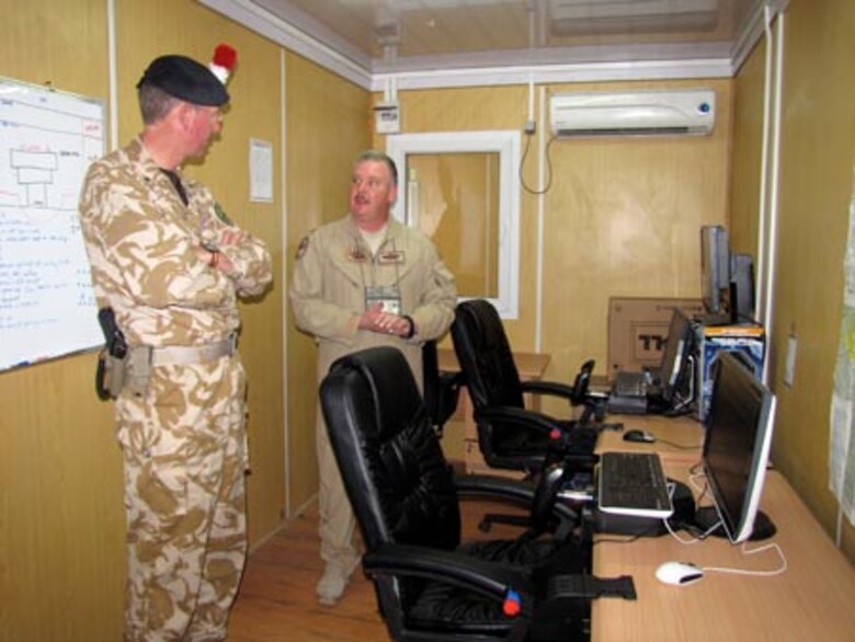 Brigadier David Paterson Commander Combined Training Advisory Group-Army tours the Afghan Air Force Thunder Lab in Kabul on August 28, 2010 (U.S. Navy photo by Mass Communications Specialist First Class Elizabeth Burke/RELEASED).