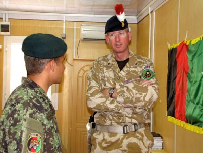 Brigadier David Paterson Commander Combined Training Advisory Group-Army tours the Afghan Air Force Thunder Lab in Kabul on August 28, 2010 (U.S. Navy photo by Mass Communications Specialist First Class Elizabeth Burke/RELEASED).