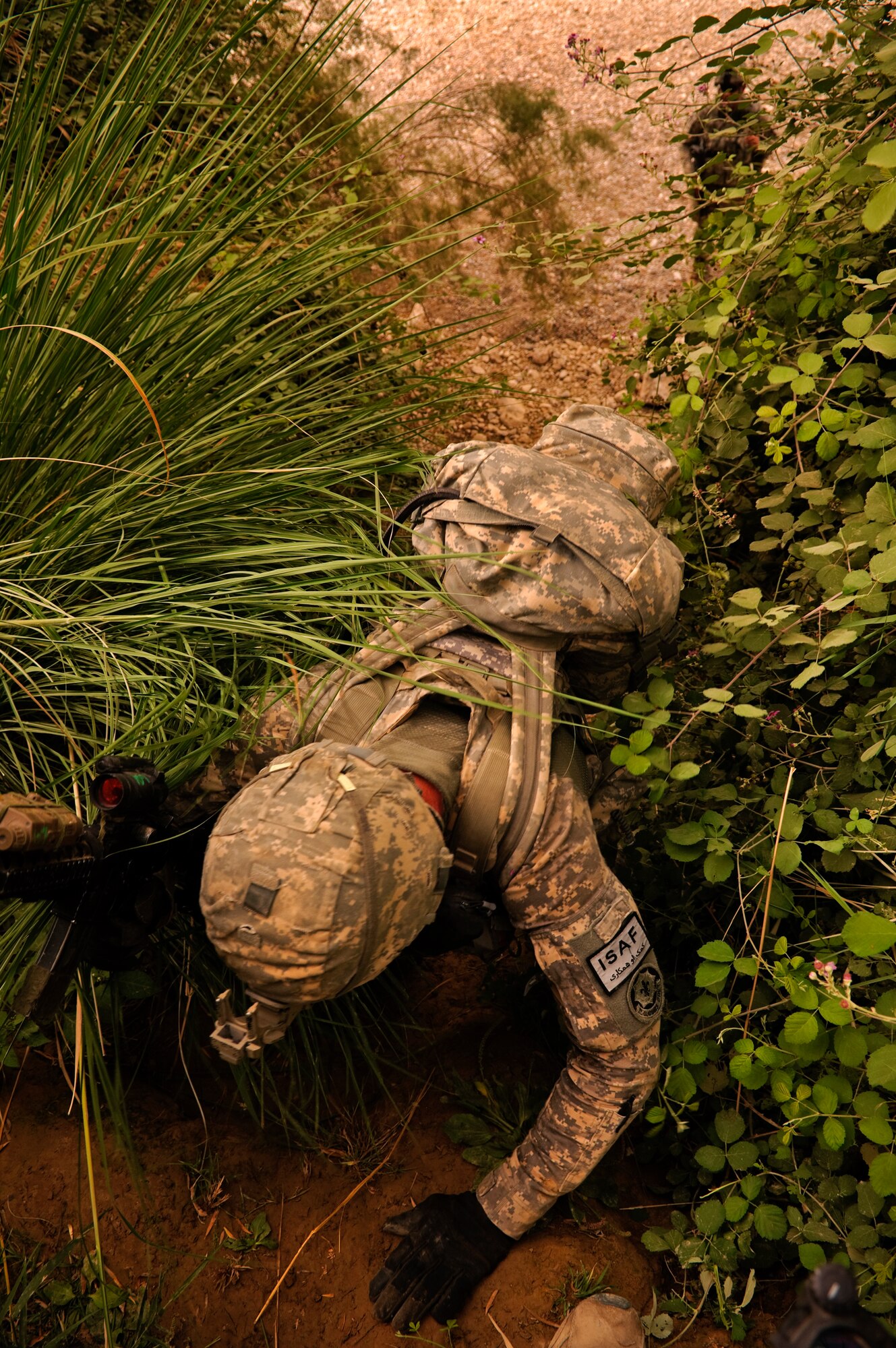 COMBAT OUTPOST MIZAN, Afghanistan - U.S. Army Pfc. Robert Brattin, a medic assigned to 3rd Platoon, Fox Company, 2nd Squadron, 2nd Stryker Cavalry Regiment and native of Jacksonville, Fl., climbs a ravine during a dismounted patrol near Combat Outpost Mizan, Mizan District, Zabul province, Aug. 26. Members of 3rd Platoon, Provincial Reconstruction Team Zabul and Afghan National Security Forces patrolled the area to meet with local elders and ensure security in the area. (U.S. Air Force Photo/Senior Airman Nathanael Callon/Released)

