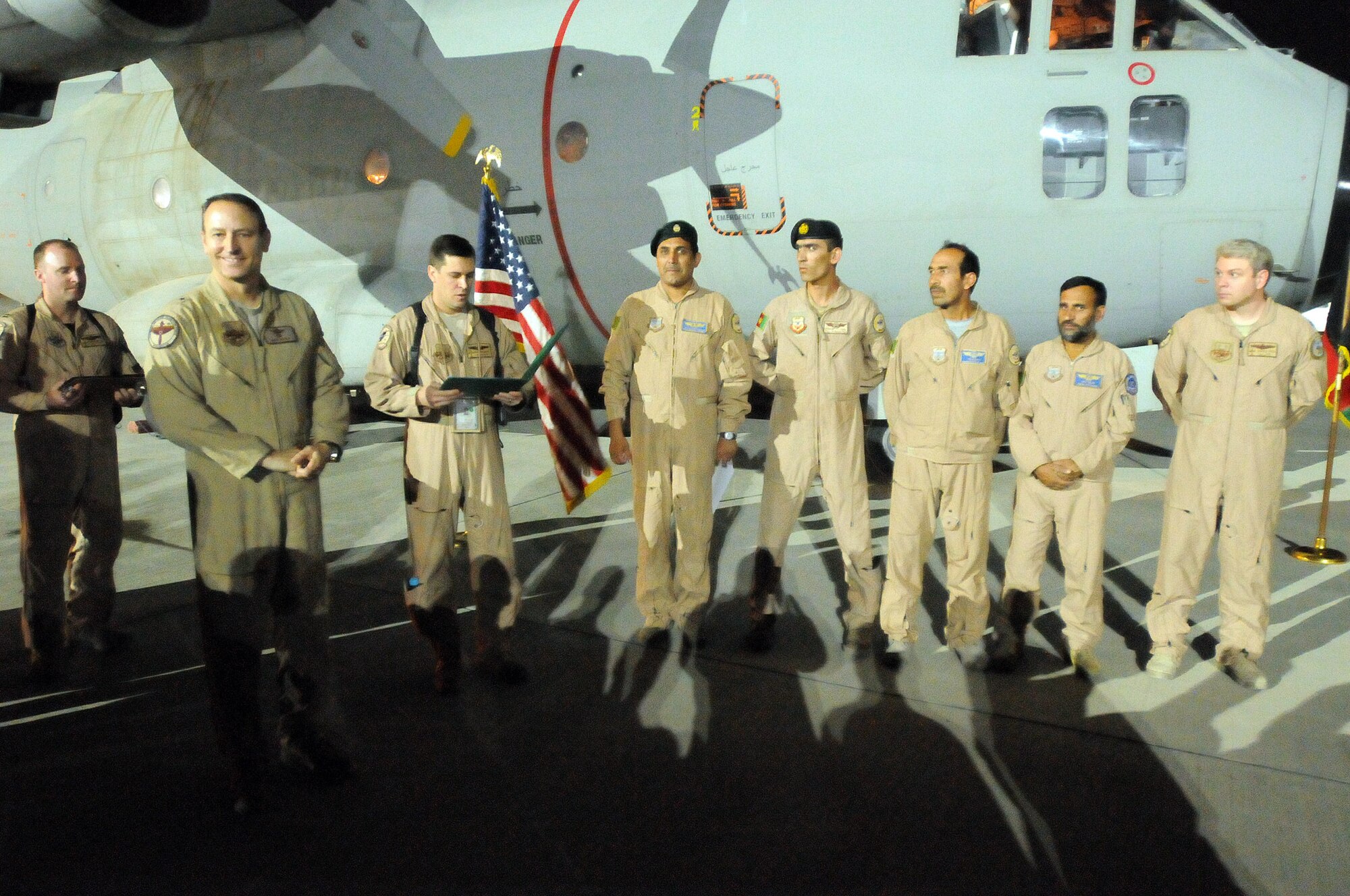 100830-N-6031Q-006 KABUL, Afghanistan -Brig. Gen. Michael Boera, Commanding General, 438th Air Expeditionary Wing, Combined Air Power Transition Force, presents Army Achievement medals to the American crew and U.S. Air Force  Achievement medals to the Afghan crew of the C-27 Spartan fixed wing aircraft in recognition of the crews exceptional performance during the first national mission flown to neighboring Pakistan earlier in the year. The medals were presented in a small ceremony on the flight line of the Afghan Air Force base in Kabul on Aug. 29, 2010. (US Navy photo by Mass Communication Specialist 2nd Class David Quillen/ RELEASED).