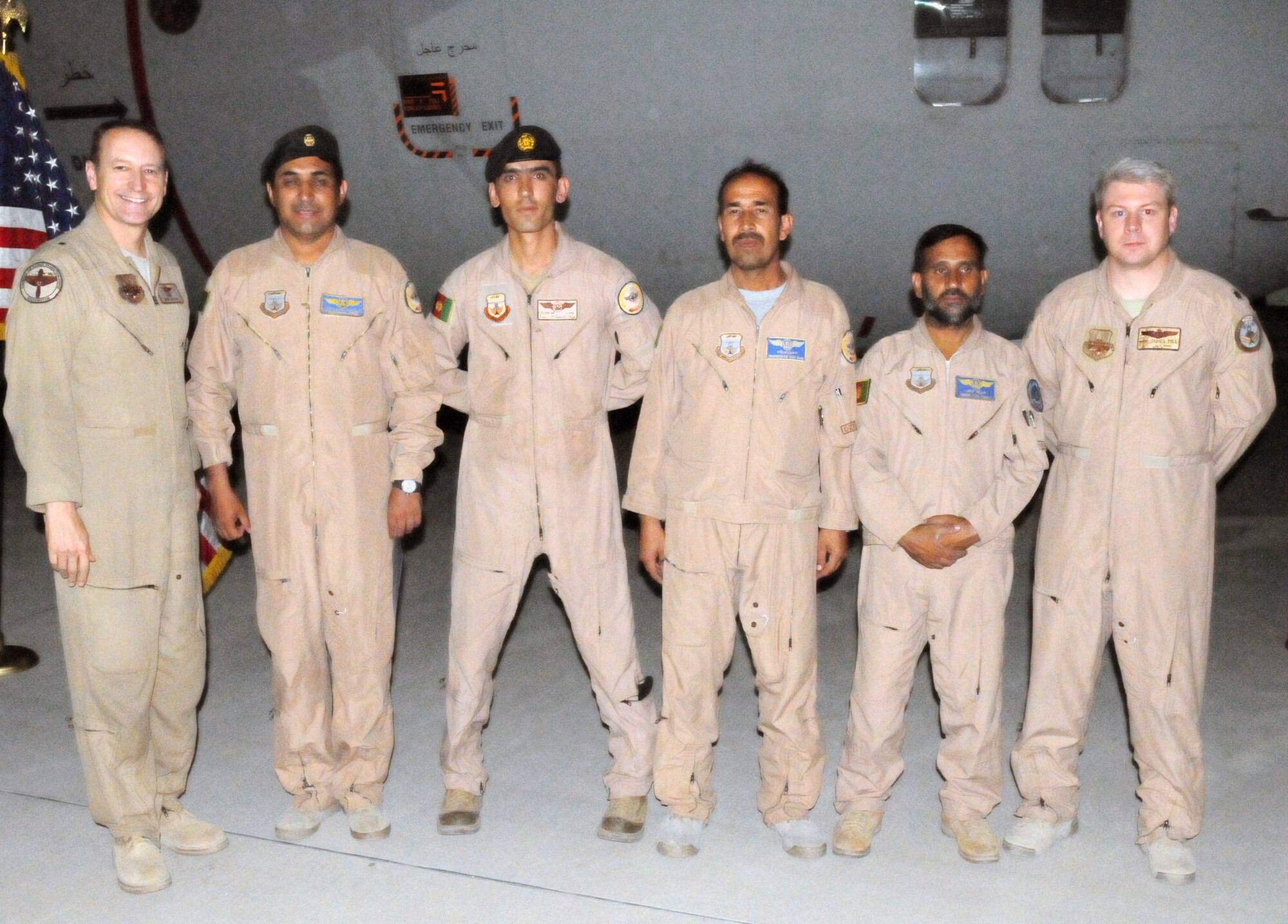 100830-N-6031Q-005 KABUL, Afghanistan -Brig. Gen. Michael Boera, Commanding General, 438th Air Expeditionary Wing, Combined Air Power Transition Force, presents a certificate of achievement to the crew of the C-27 Spartan fixed wing aircraft after its completion of 1000 hours of flight time in Afghanistan. The certificates were presented in a small ceremony on the flight line of the Afghan Air Force base in Kabul on Aug. 29, 2010. (US Navy photo by Mass Communication Specialist 2nd Class David Quillen/ RELEASED).