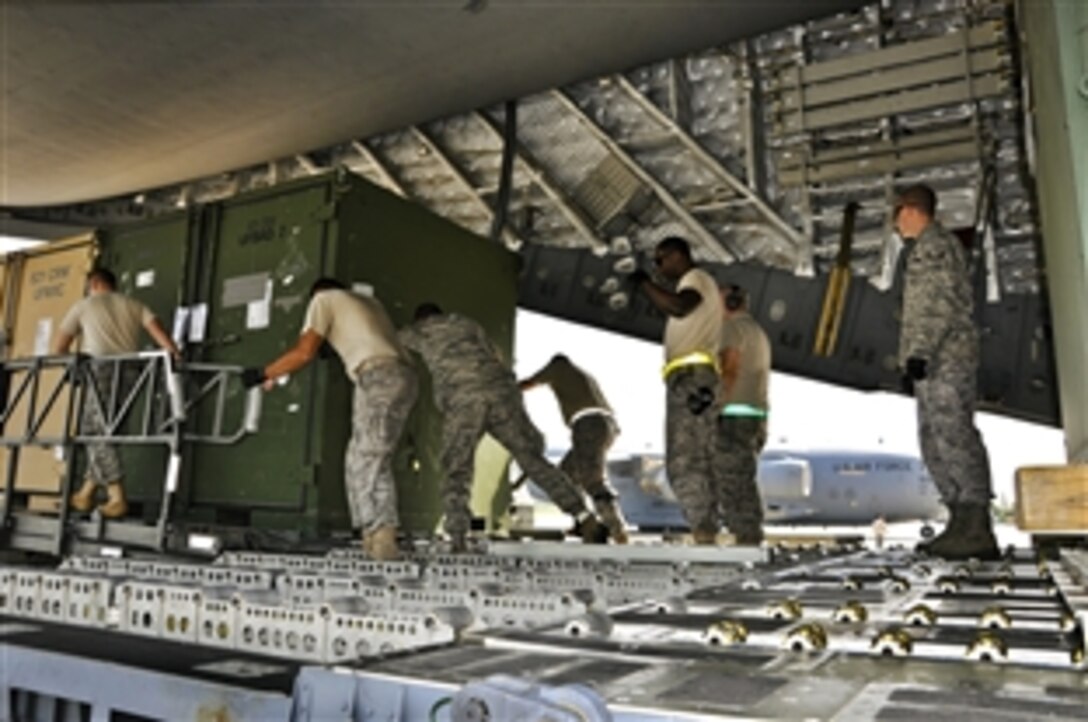 U.S. Air Force airmen unload supplies from a U.S. Air Force C-17 cargo aircraft on Pakistan Air Force Base Chaklala, Rawalpindi, Pakistan, Aug. 29, 2010. About 40 airmen assigned to the U.S. Air Force's 621st Contingency Response Wing will work in partnership with Pakistani officials to support humanitarian airlift operations to deliver relief supplies to locations throughout Pakistan.