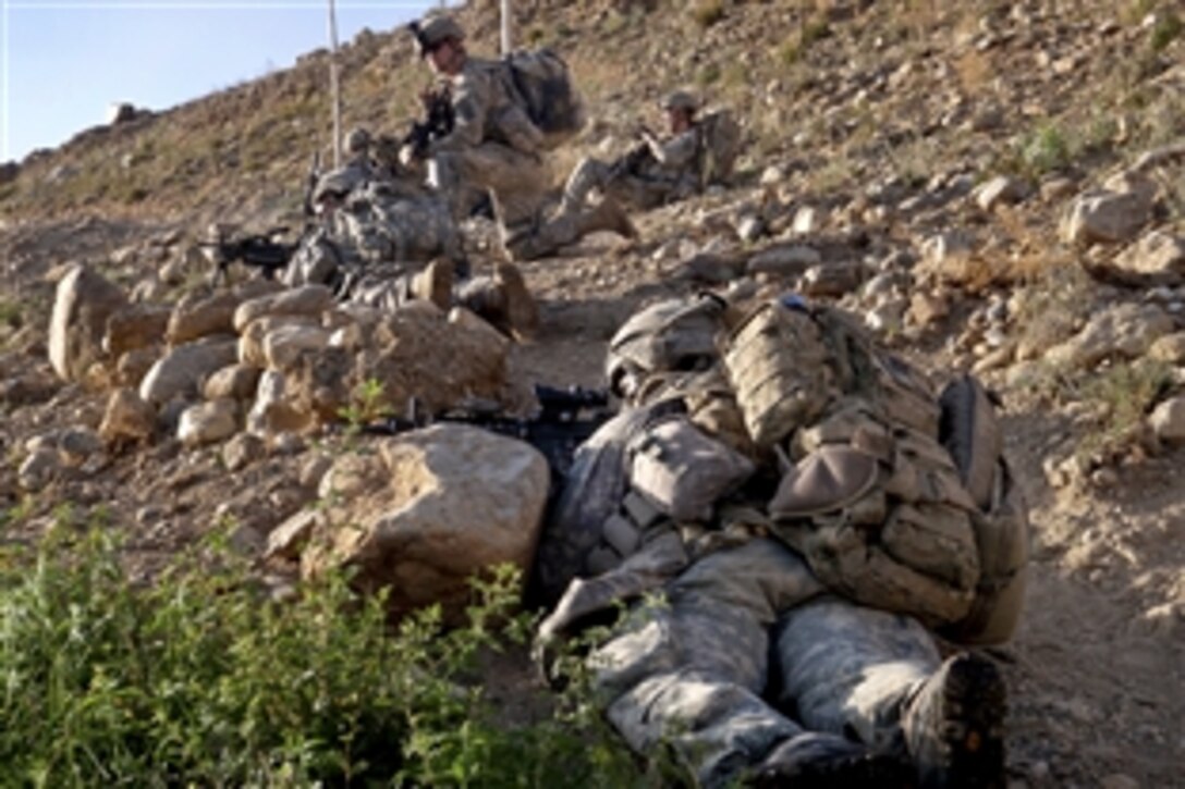 U.S. Army paratroopers provide security halfway up a mountain as they move toward an objective in Jaghatu district, Wardak province, Afghanistan, Aug. 21, 2010. The soldiers are assigned to the 1st Battalion, 503rd Infantry Regiment, 173rd Airborne Brigade Combat Team.
