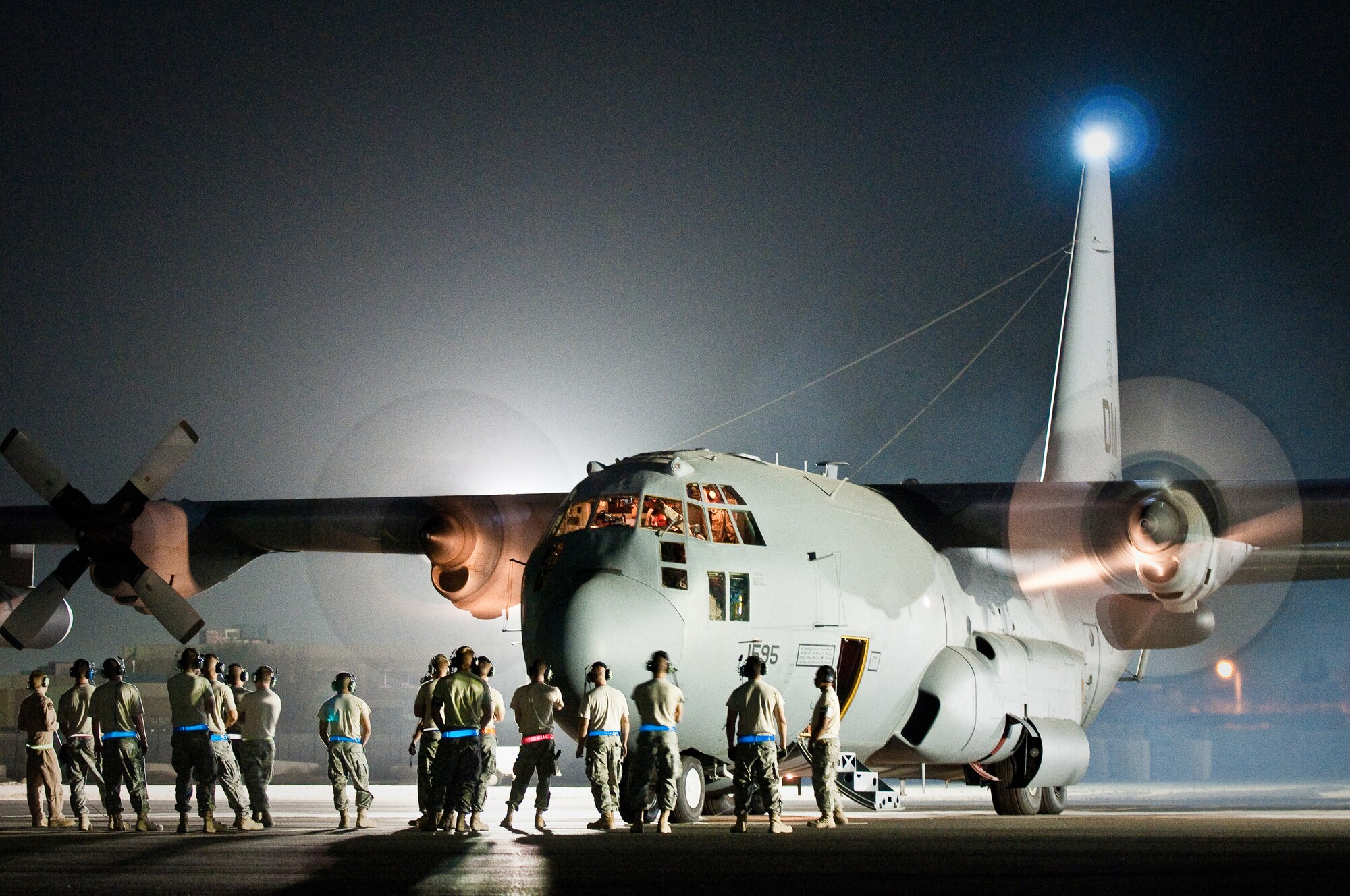 Maintenance troops and aircrew members prepare anEC-130H for its final departure Aug. 29, 2010, in Southwest Asia. The plane's unit, the 43rd Expeditionary Electronic Combat Squadron, has been part of the 386th Air Expeditionary Wing for 6.5 years and is moving to another base in the U.S. Central Command area of responsibility because of the responsible drawdown of forces in Iraq. The EC-130H provides U.S. forces with the ability to jam enemy communications. (U.S. Air Force photo/Maj. Dale Greer)