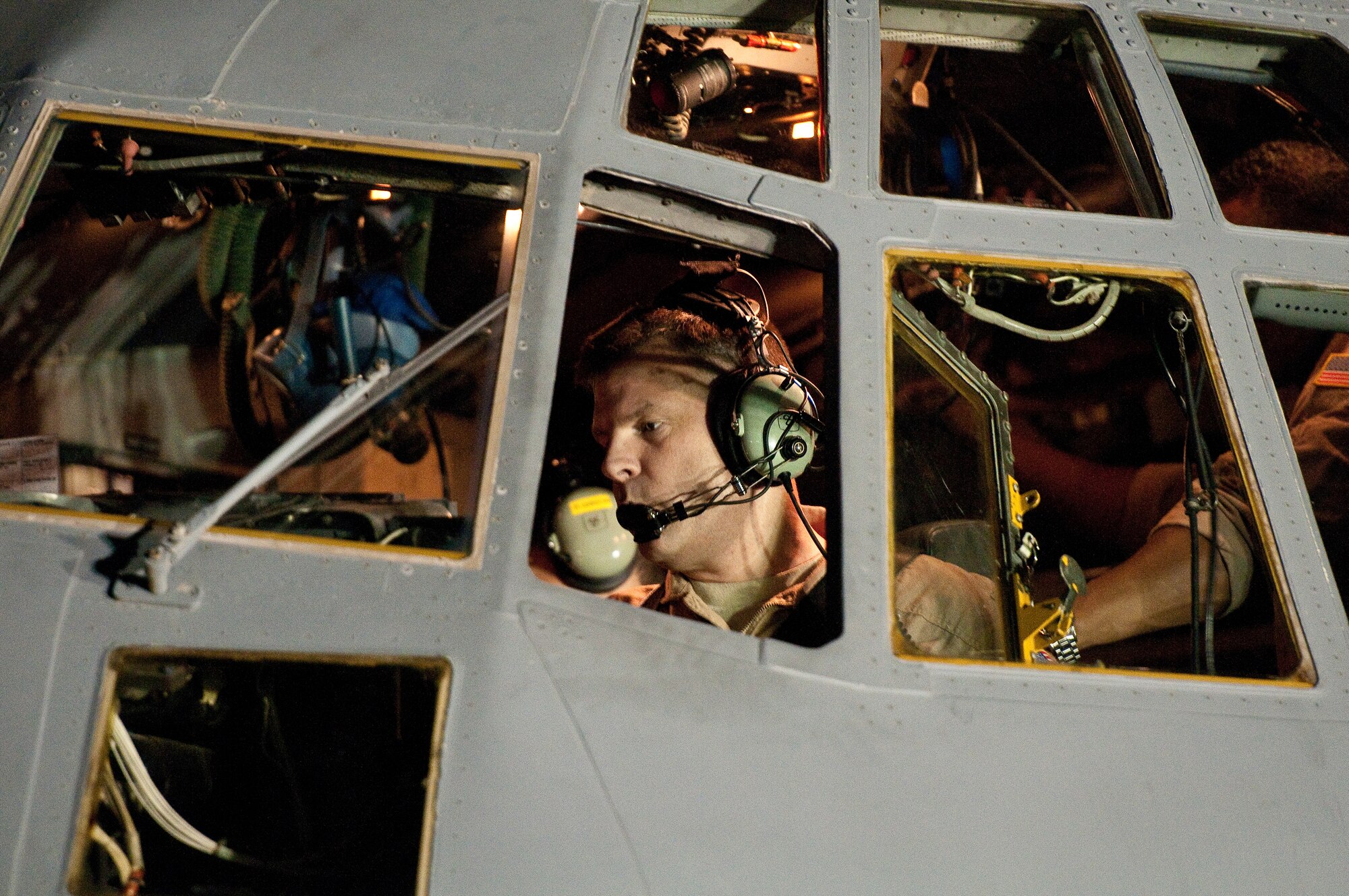 Col. Scott Brewer runs through a pre-flight checklist as he prepares to pilot a U.S. Air Force EC-130H aircraft assigned to the 43rd Expeditionary Electronic Combat Squadron Aug. 29, 2010, in Southwest Asia. The plane's unit, the 43rd Expeditionary Electronic Combat Squadron, has been part of the 386th Air Expeditionary Wing for 6.5 years and is moving to another base in the U.S. Central Command area of responsibility because of the responsible drawdown of forces in Iraq. The EC-130H provides U.S. forces with the ability to jam enemy communications. Colonel Brewer is the commander of the 386th Expeditionary Operations Group. (U.S. Air Force photo/Maj. Dale Greer)