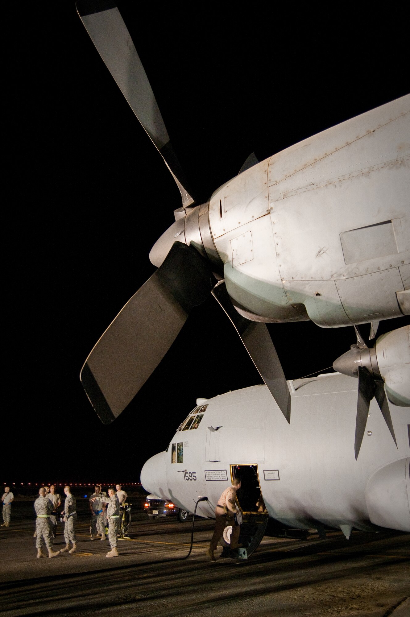 Maintenance troops and aircrew members prepare anEC-130H for its final departure Aug. 29, 2010, in Southwest Asia. The plane's unit, the 43rd Expeditionary Electronic Combat Squadron, has been part of the 386th Air Expeditionary Wing for 6.5 years and is moving to another base in the U.S. Central Command area of responsibility because of the responsible drawdown of forces in Iraq. The EC-130H provides U.S. forces with the ability to jam enemy communications. (U.S. Air Force photo/Maj. Dale Greer)