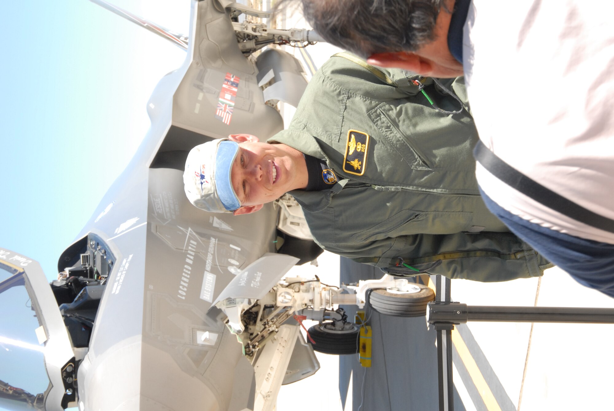 Lt. Col. George H. Griffiths, 418th Flight Test Squadron commander, poses for a photo in front of the F-35 Lightning II he flew on a flight test Aug. 27. The Air Force Flight Test Center held a media day to highlight developmental testing and evaluation of the Joint Strike Fighter at Edwards.  (Air Force photo by Stephen K. Robinson)