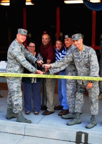 From left to right, 628th Mission Support Group Commander Col. Ben Wham; 628th Contracting Squadron Contract Administrator Monica Christie; 628th Civil Engineering Squadron Project Manager Joe Rackley; Chief Project Manager David Plains, a civilian contractor; acting 628th Security Forces Commander Capt. Matthew Foisy and 628th Civil Engineering Squadron Commander Lt. Col. Richard Sanders cut the ribbon at the opening ceremony for the Combat Arms Training and Maintenance range facility Aug. 31, 2010, on Joint Base Charleston, S.C. The range was repaired due to safety deficiencies and resumed training operations June 22 after a successful series of tests. The project started March 26 and was completed June 21 at a cost of nearly $500,000. (U.S. Air Force photo/Senior Airman Timothy Taylor)