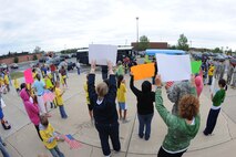 MINOT AIR FORCE BASE, N.D. -- Family members and friends welcome home the children during their reintegration from the simulated deployment as a part of Operation Heroes here Aug. 28. More than 300 service members and their families participated in the fourth annual event. Operation Heroes is a virtual deployment for military children and spouses, giving them the opportunity to see what parents and spouses experience prior to and during a deployment. (U.S. Air Force photo by Airman 1st Class Aaron-Forrest Wainwright)