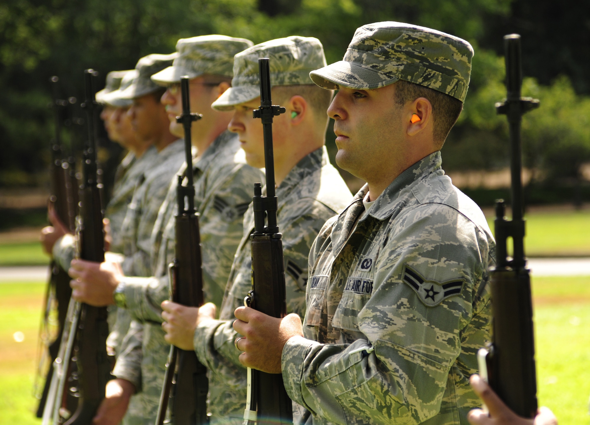 Airman 1st Class Robert Dean, assigned to the 62nd Operations Support Squadron, concentrates while performing a firing party demonstration during an Honor Guard graduation ceremony Aug. 30 at Joint Base Lewis-McChord, Wash. (U.S. Air Force Photo/Airman Leah Young)