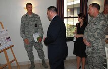 LAUGHLIN AIR FORCE BASE, Texas – Lt. Col. Dee Katzer, 47th Civil Engineering Squadron commander, and Col. Michael Frankel, 47th Flying Training Wing commander, present a plan to rebuild Laughlin’s officer dormitories to Erasmo Valles, a staffer from Congressman Ciro Rodriguez’s office. The team spent the morning of Aug. 27 touring numerous Laughlin facilities including the dorms, the Aircraft Maintenance Operations Center and the simulator building. (U.S. Air Force photos/Airman 1st Class Blake Mize)