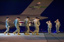 A U.S. Army carry team transfers the remains of Army Pvt. Charles M. High, of Albuquerque, N.M., at Dover Air Force Base, Del., August 19. Pvt. High was assigned to the 1st Battalion, 327th Infantry Regiment, 1st Brigade Combat Team, 101st Airborne Division (Air Assault), Fort Campbell, Ky. (U.S. Air Force photo/Roland Balik)