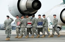 17 August 2010  USAF Photo by Jason Minto.  A U.S. Army carry team transfers the remains of Army SPC Jamal M. Rhett of Palmyra, NJ at Dover Air Force Base, Del., August 17, 2010.